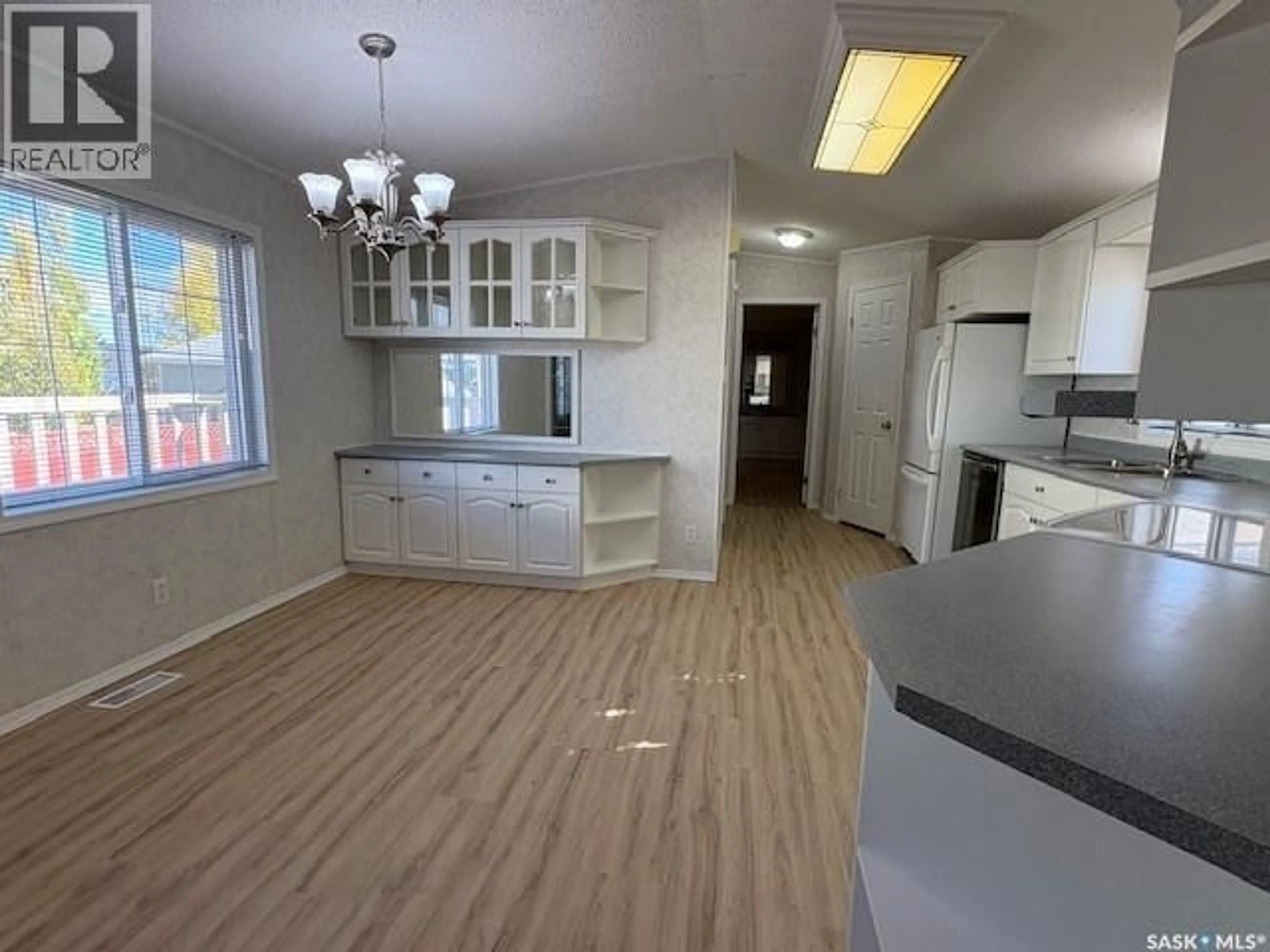 Open concept kitchen, wood/laminate floor for 498 1ST STREET W, Vibank Saskatchewan S0G4Y0