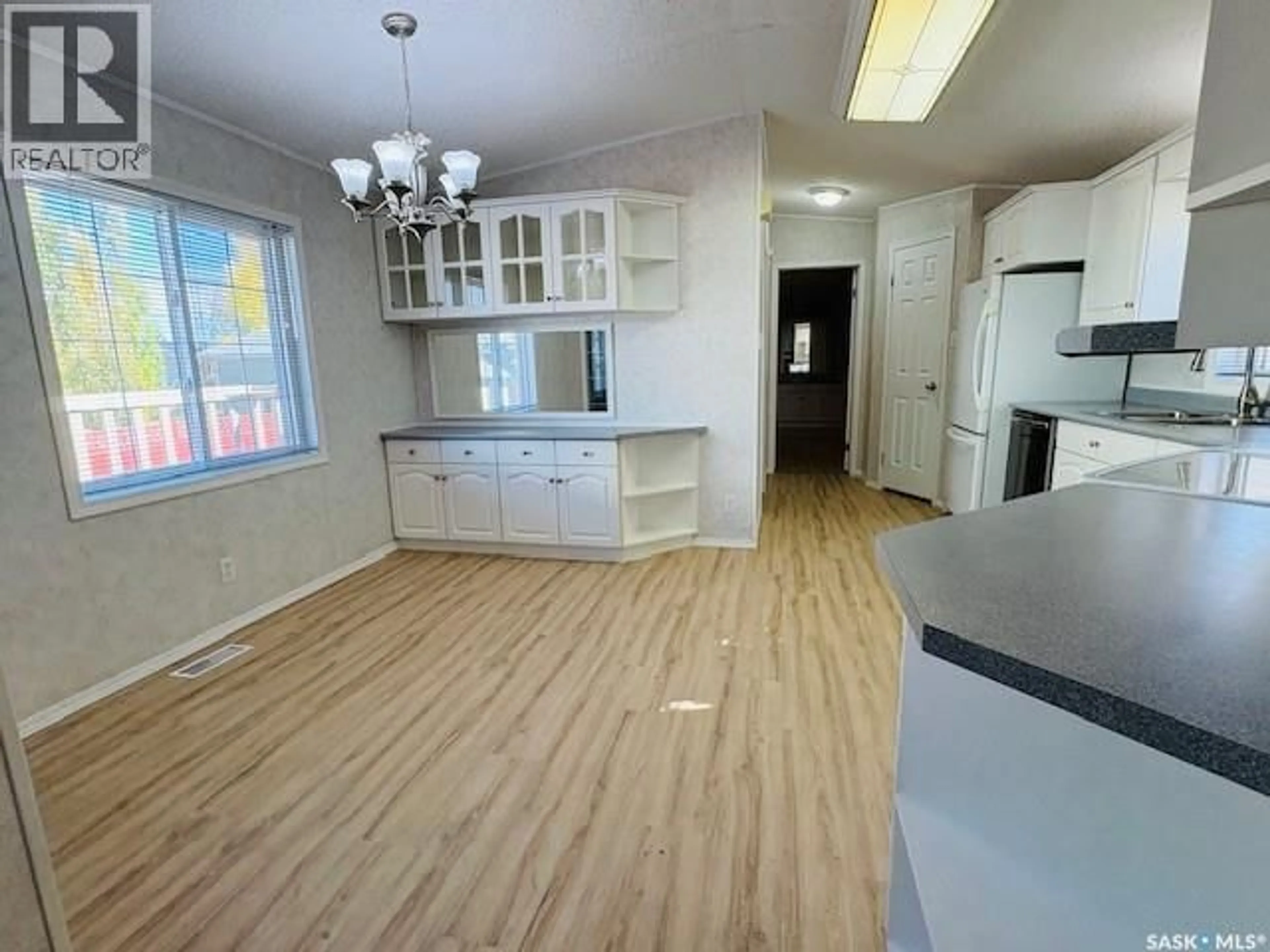 Open concept kitchen, wood/laminate floor for 498 1ST STREET W, Vibank Saskatchewan S0G4Y0