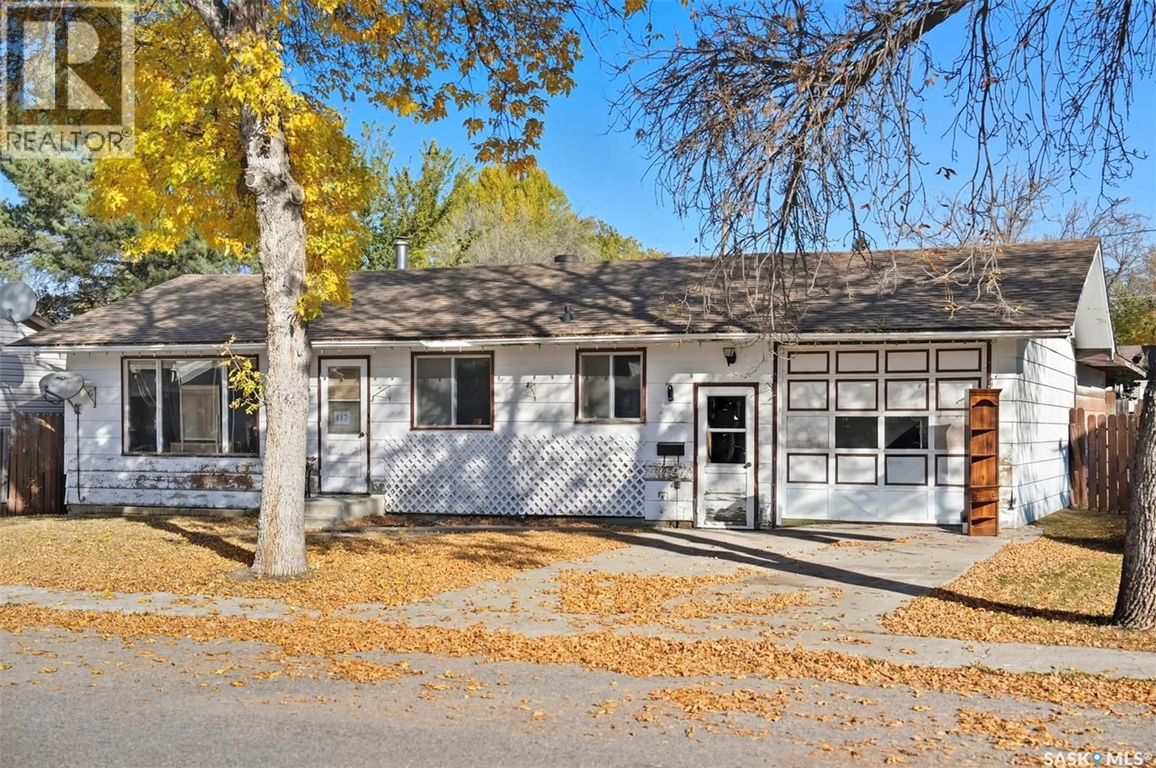 Home with vinyl exterior material, street for 117 3RD STREET, Langham Saskatchewan S0K2L0