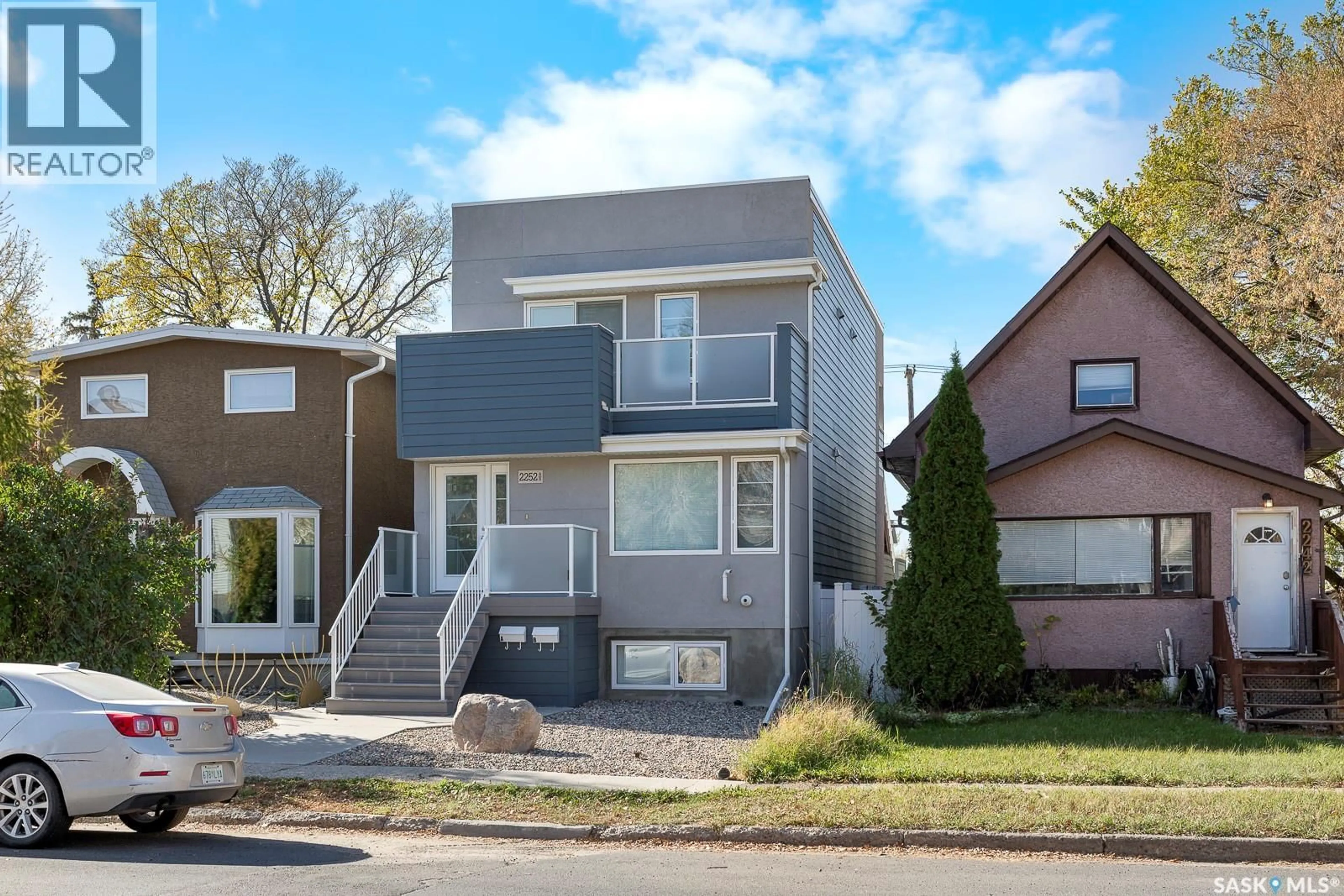 Home with vinyl exterior material, street for 2252 PASQUA STREET, Regina Saskatchewan S4T4M4