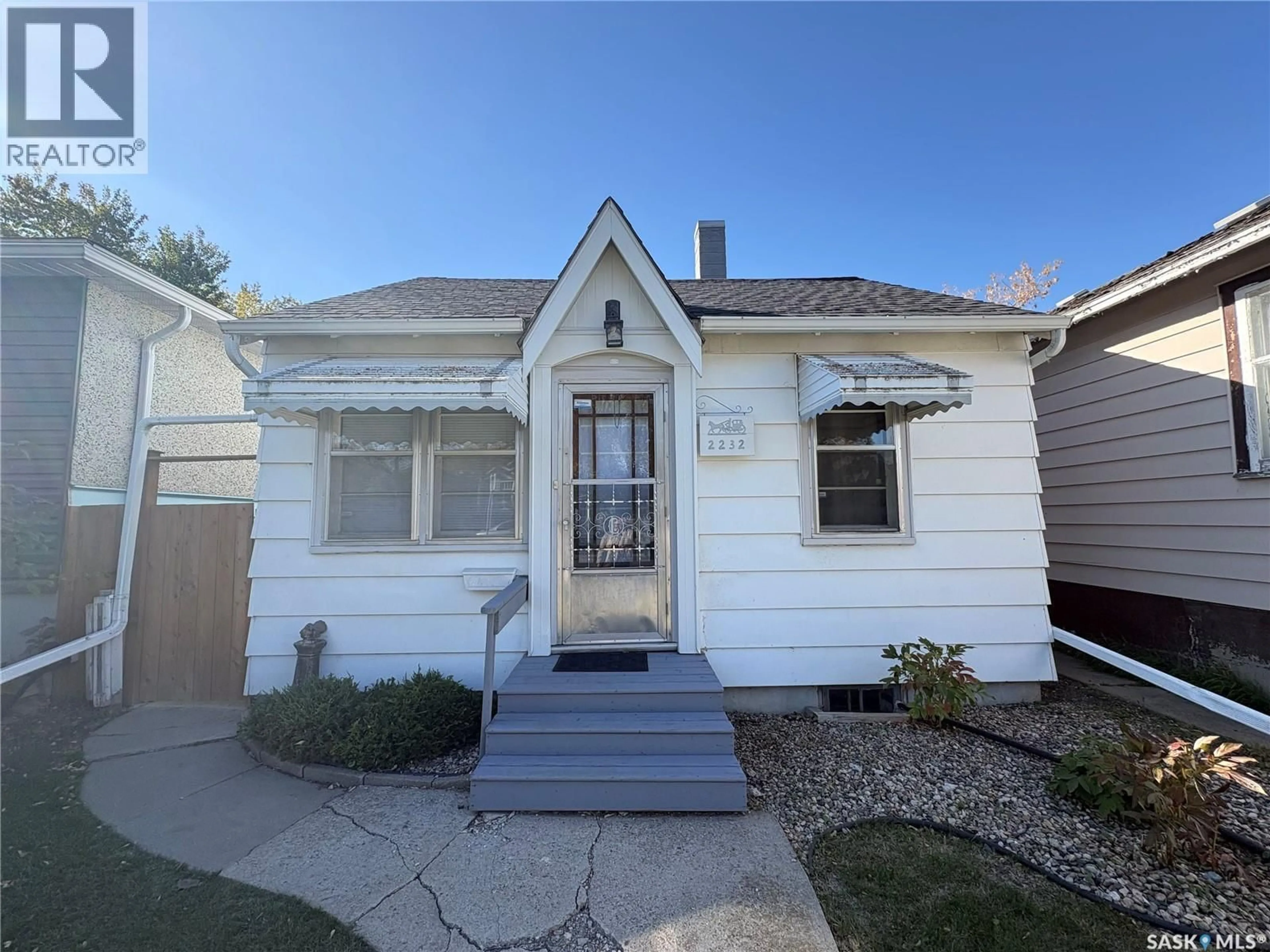 Home with vinyl exterior material, street for 2232 BRODER STREET, Regina Saskatchewan S4N3S6