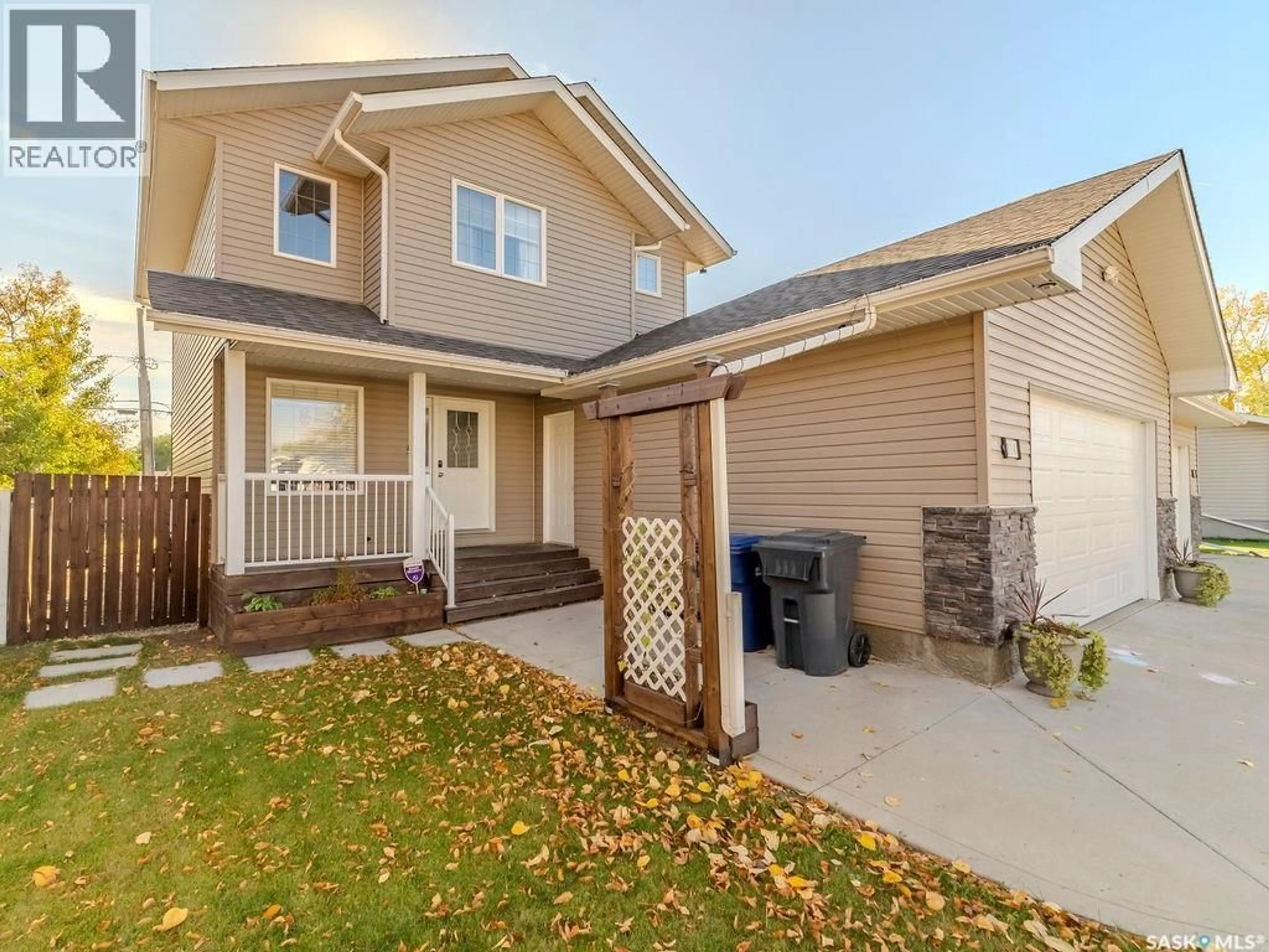 Home with vinyl exterior material, street for 214 1ST STREET, Martensville Saskatchewan S0K2T0