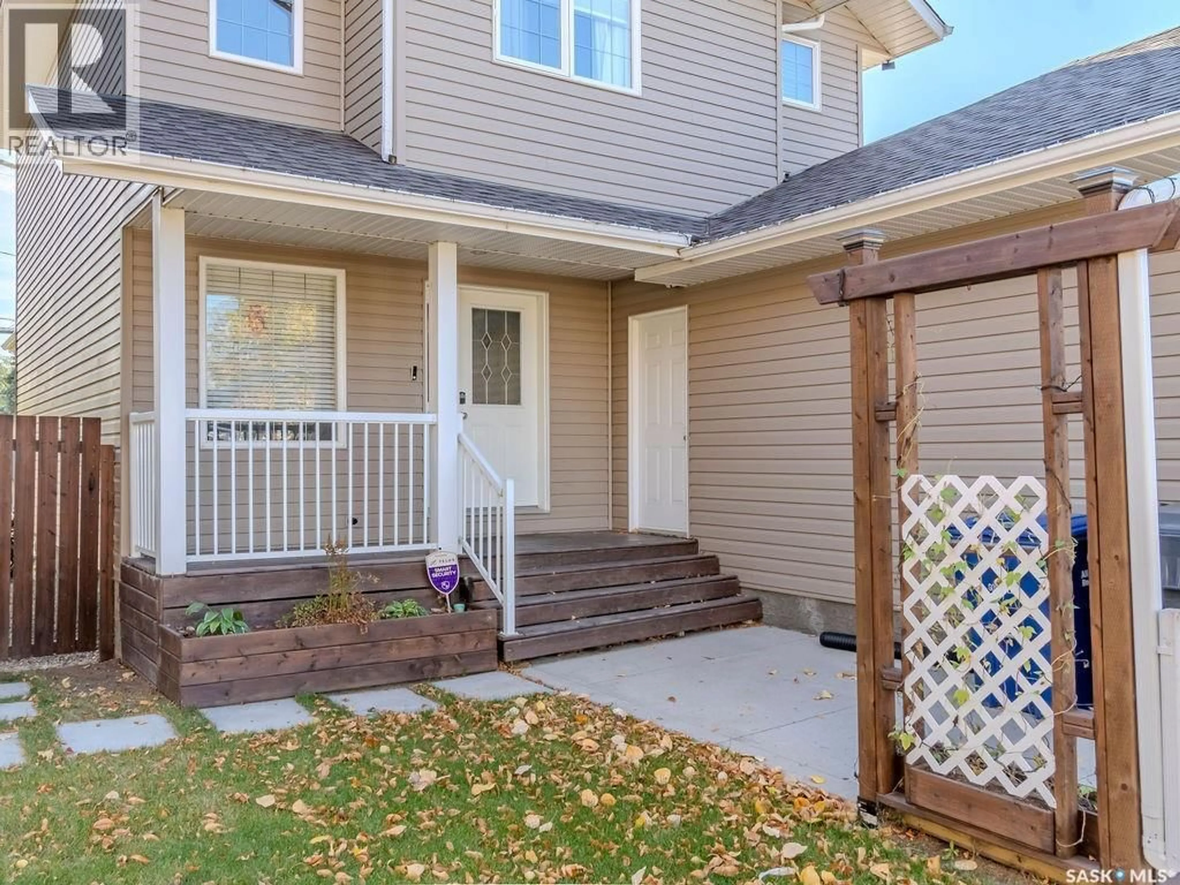 Home with vinyl exterior material, street for 214 1ST STREET, Martensville Saskatchewan S0K2T0