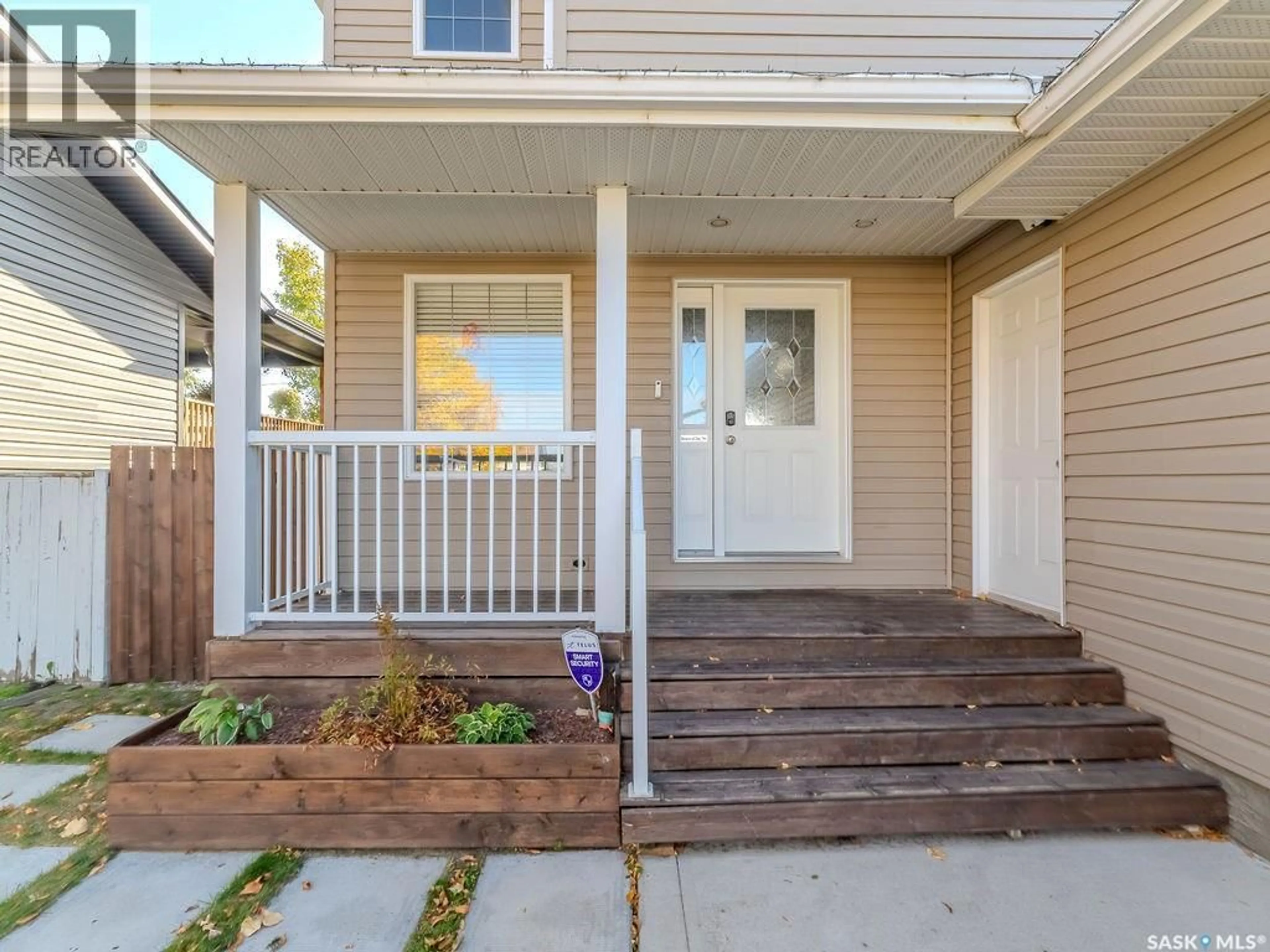 Home with vinyl exterior material, street for 214 1ST STREET, Martensville Saskatchewan S0K2T0