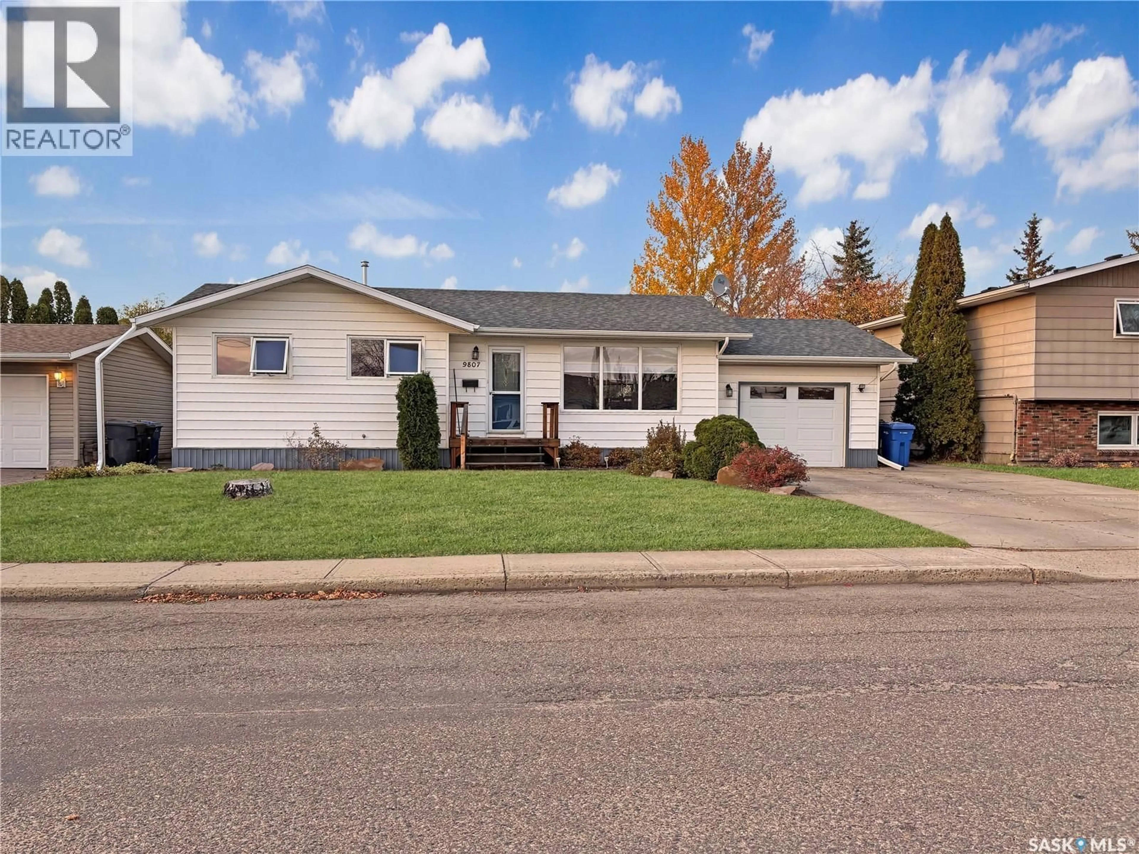 Home with vinyl exterior material, street for 9807 21ST AVENUE, North Battleford Saskatchewan S9A3K4