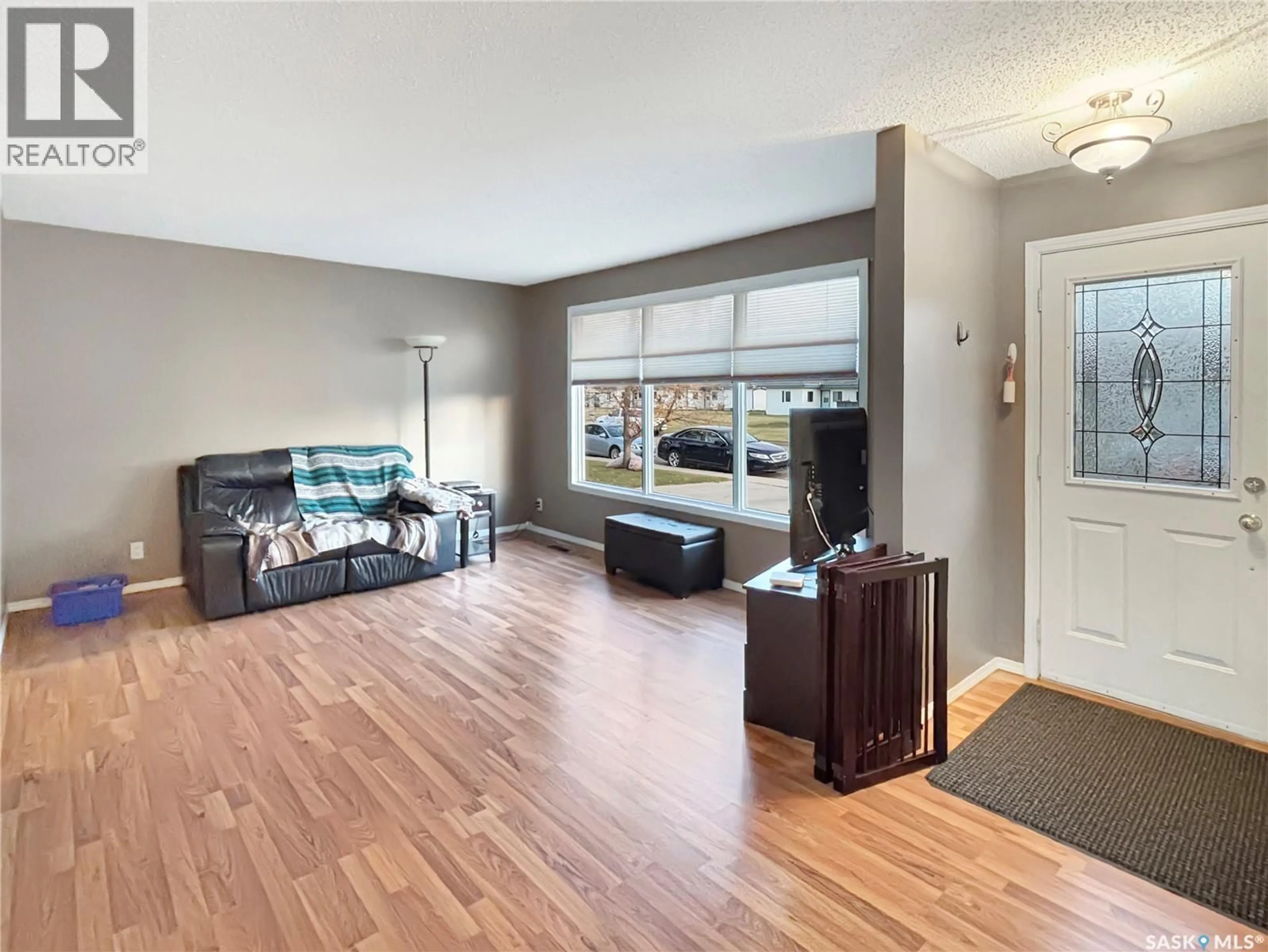 Living room with furniture, unknown for 9807 21ST AVENUE, North Battleford Saskatchewan S9A3K4