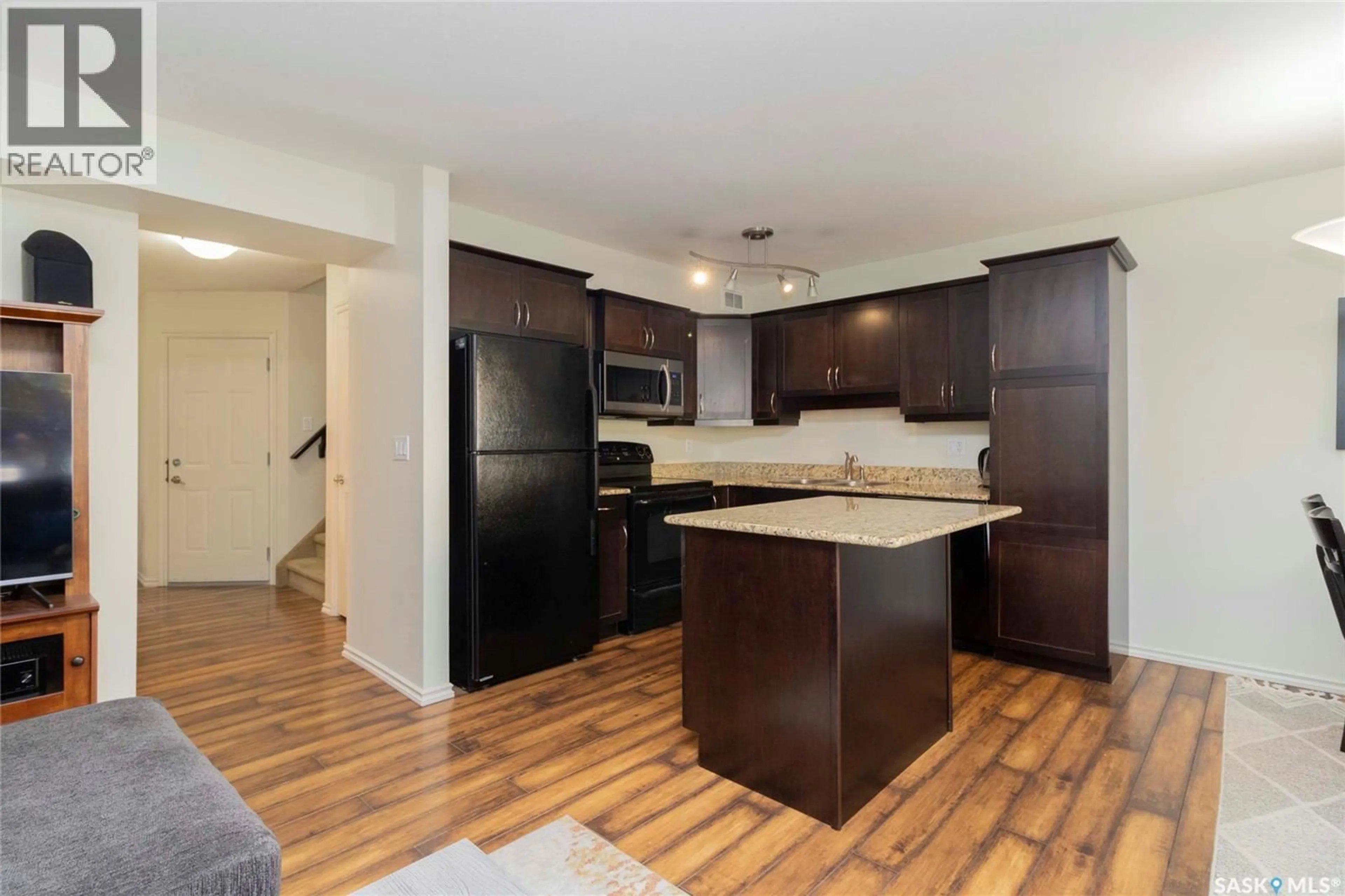Open concept kitchen, wood/laminate floor for 615 - 105 LYND CRESCENT, Saskatoon Saskatchewan S7T0G7