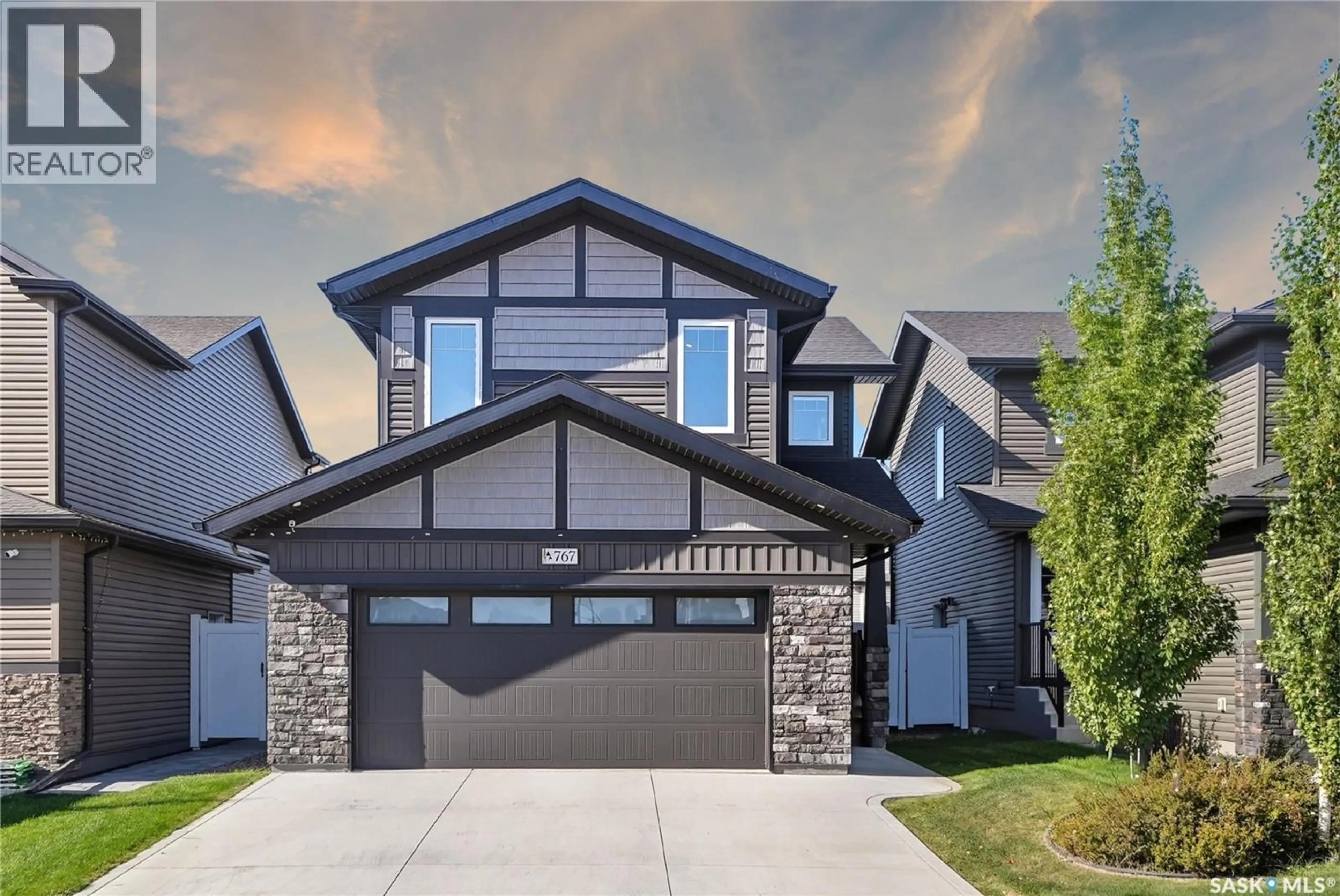 Home with brick exterior material, street for 767 MCFAULL LANE, Saskatoon Saskatchewan S7V0S8