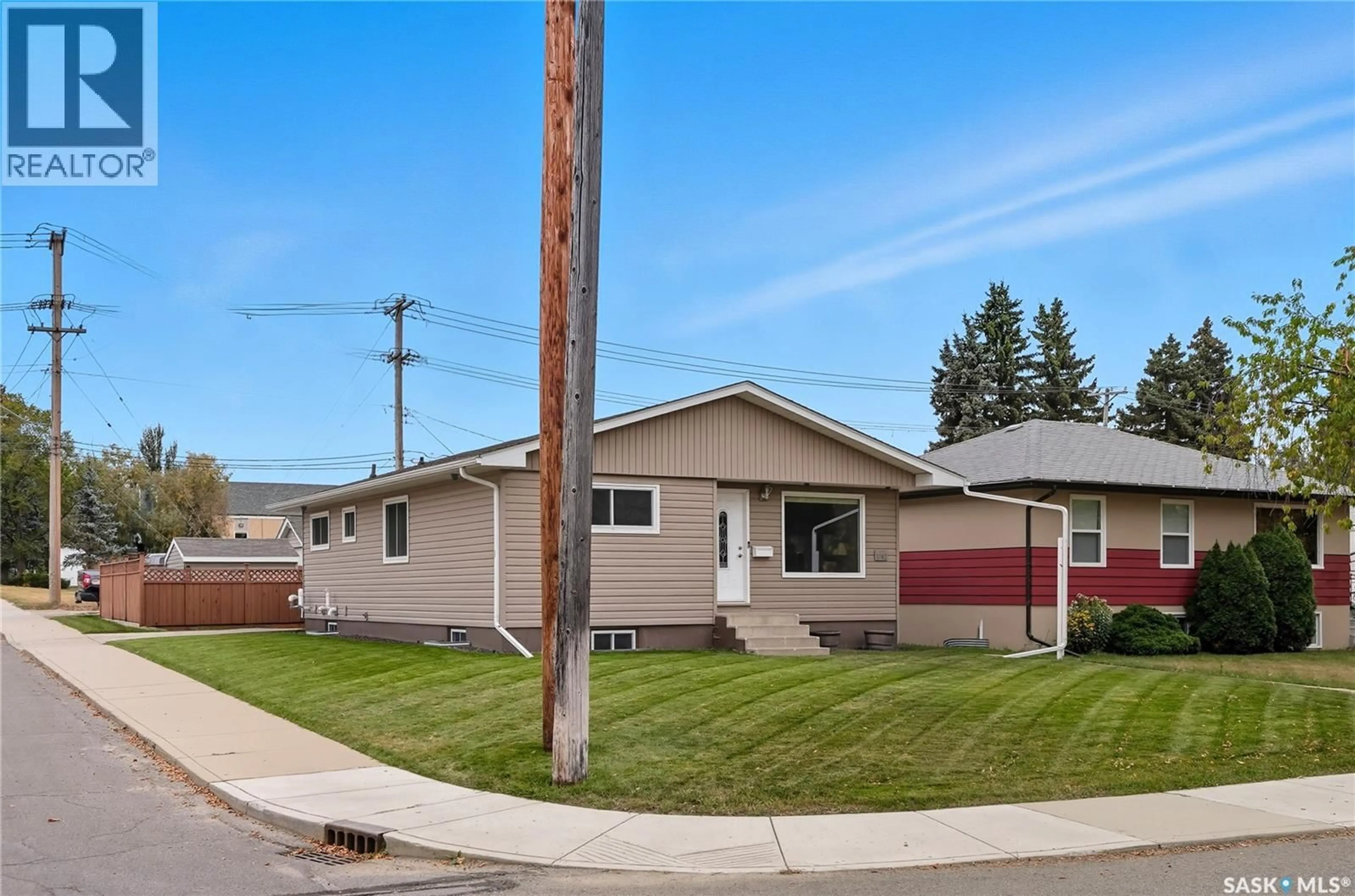 Home with vinyl exterior material, street for 1042 J AVENUE, Saskatoon Saskatchewan S7L2L4