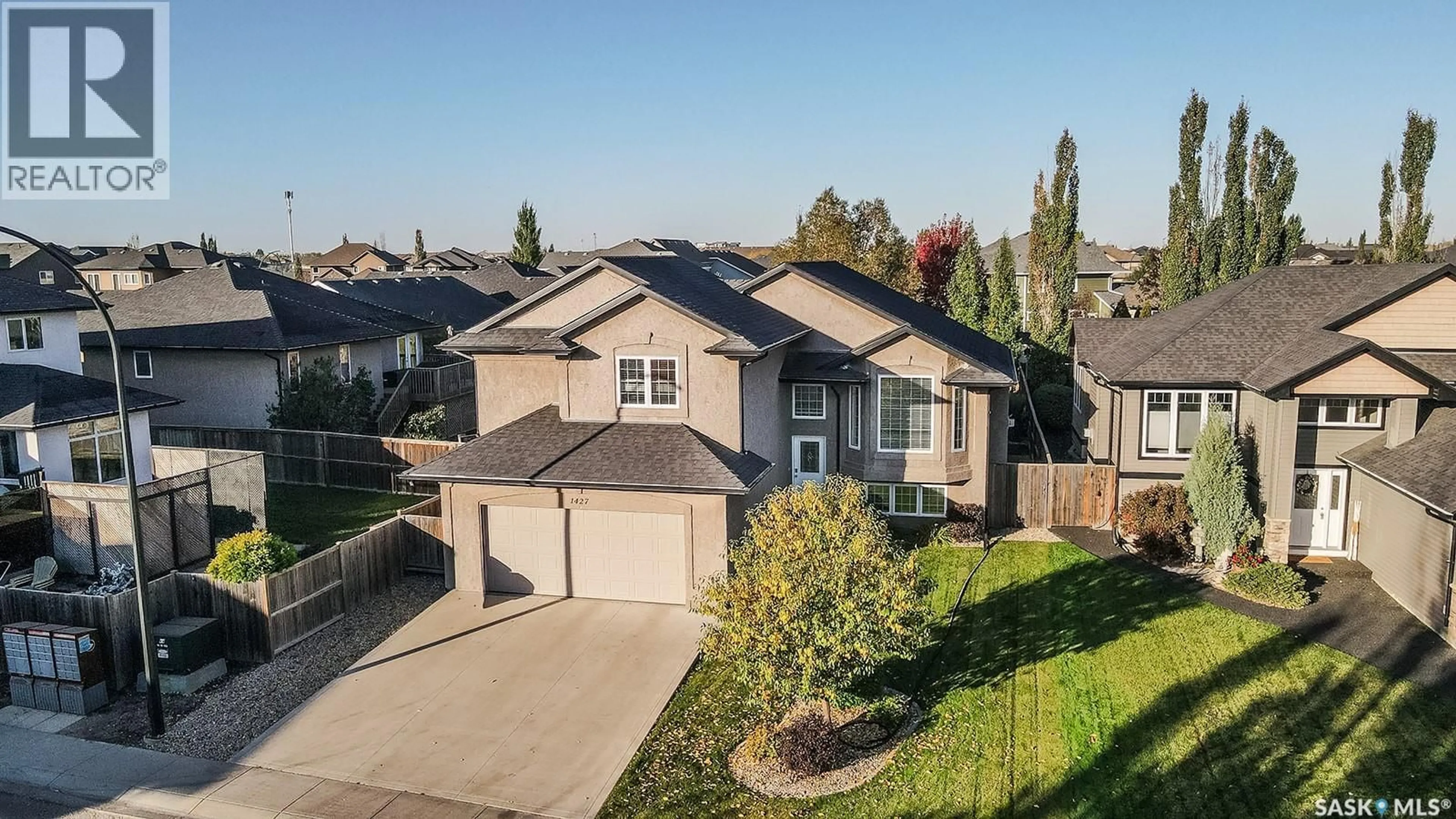 A pic from outside/outdoor area/front of a property/back of a property/a pic from drone, street for 1427 SHEPHERD LANE, Saskatoon Saskatchewan S7W0B3