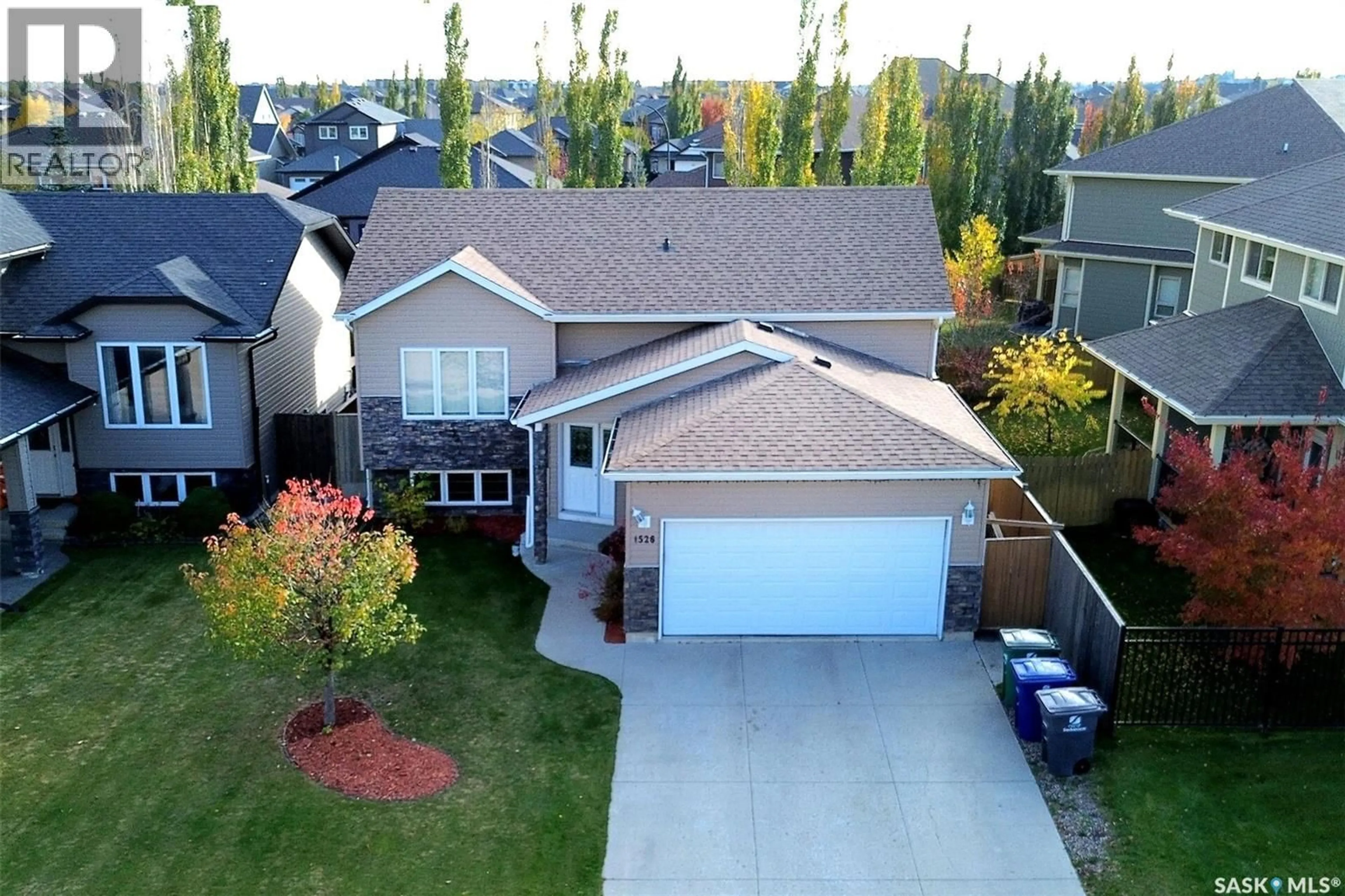 A pic from outside/outdoor area/front of a property/back of a property/a pic from drone, street for 1526 PATON CRESCENT, Saskatoon Saskatchewan S7W0C3