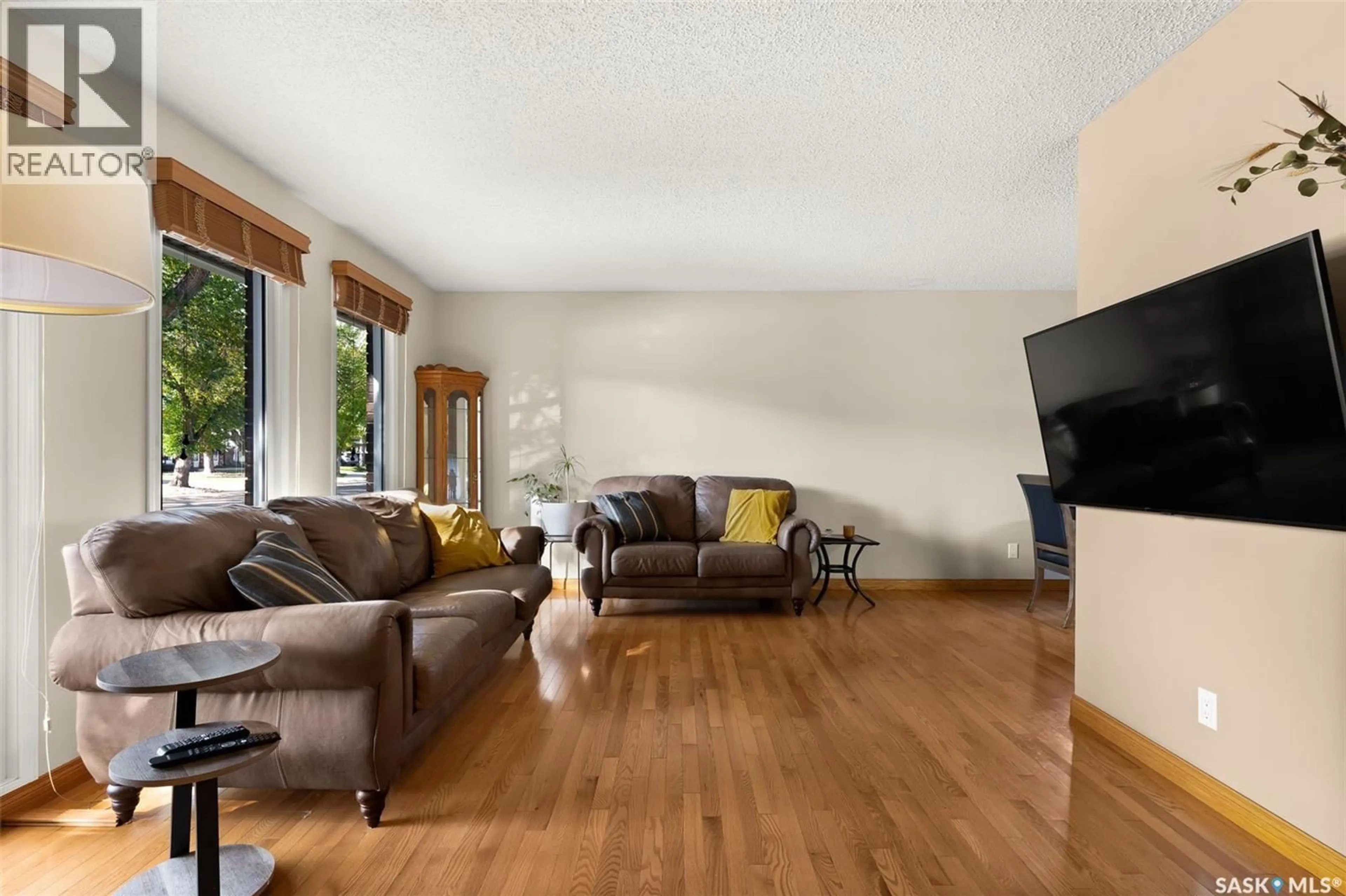 Living room with furniture, wood/laminate floor for 12 JACKSON BAY, Regina Saskatchewan S4R6Y8