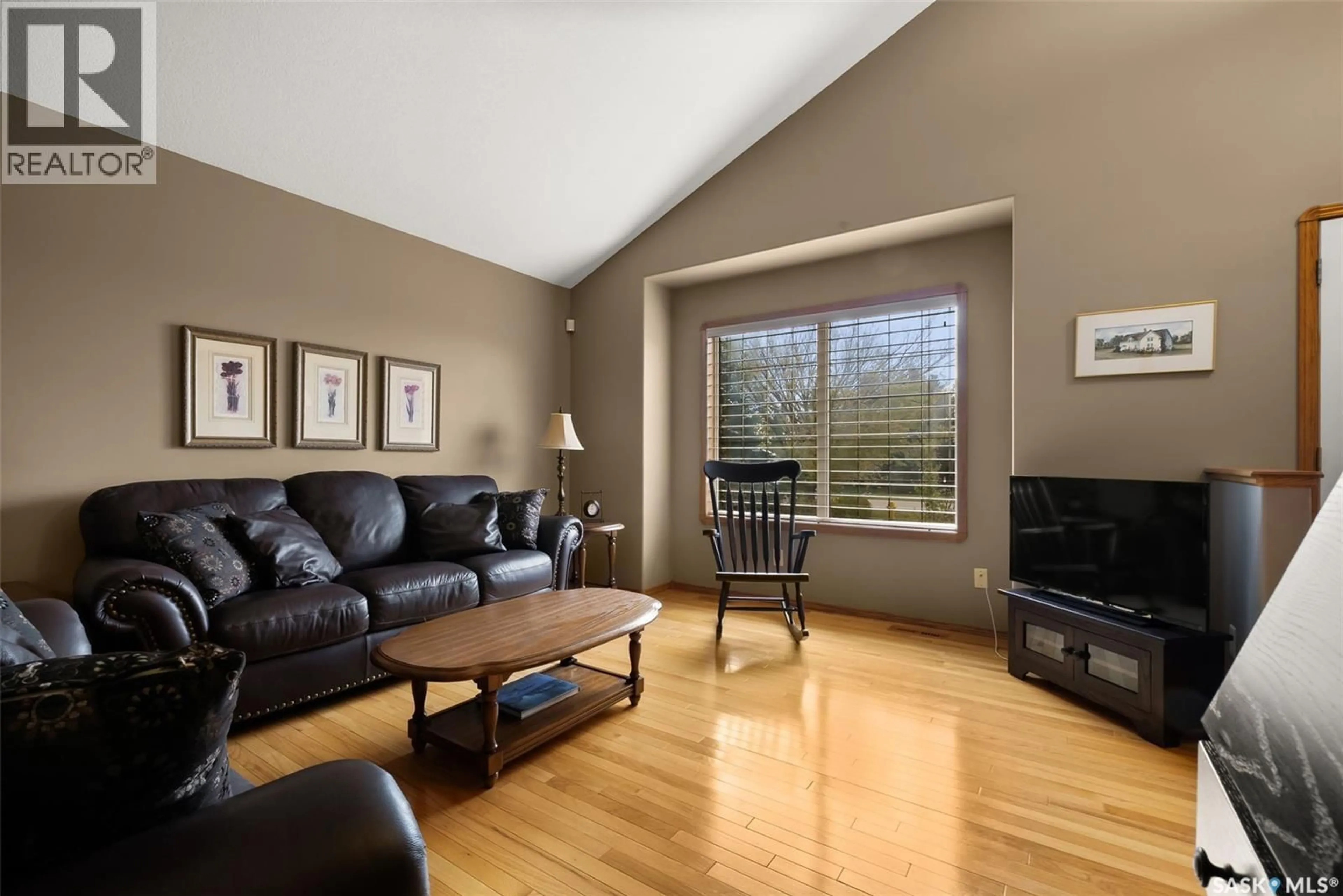 Living room with furniture, wood/laminate floor for 19 LOTT ROAD, White City Saskatchewan S4L5B1