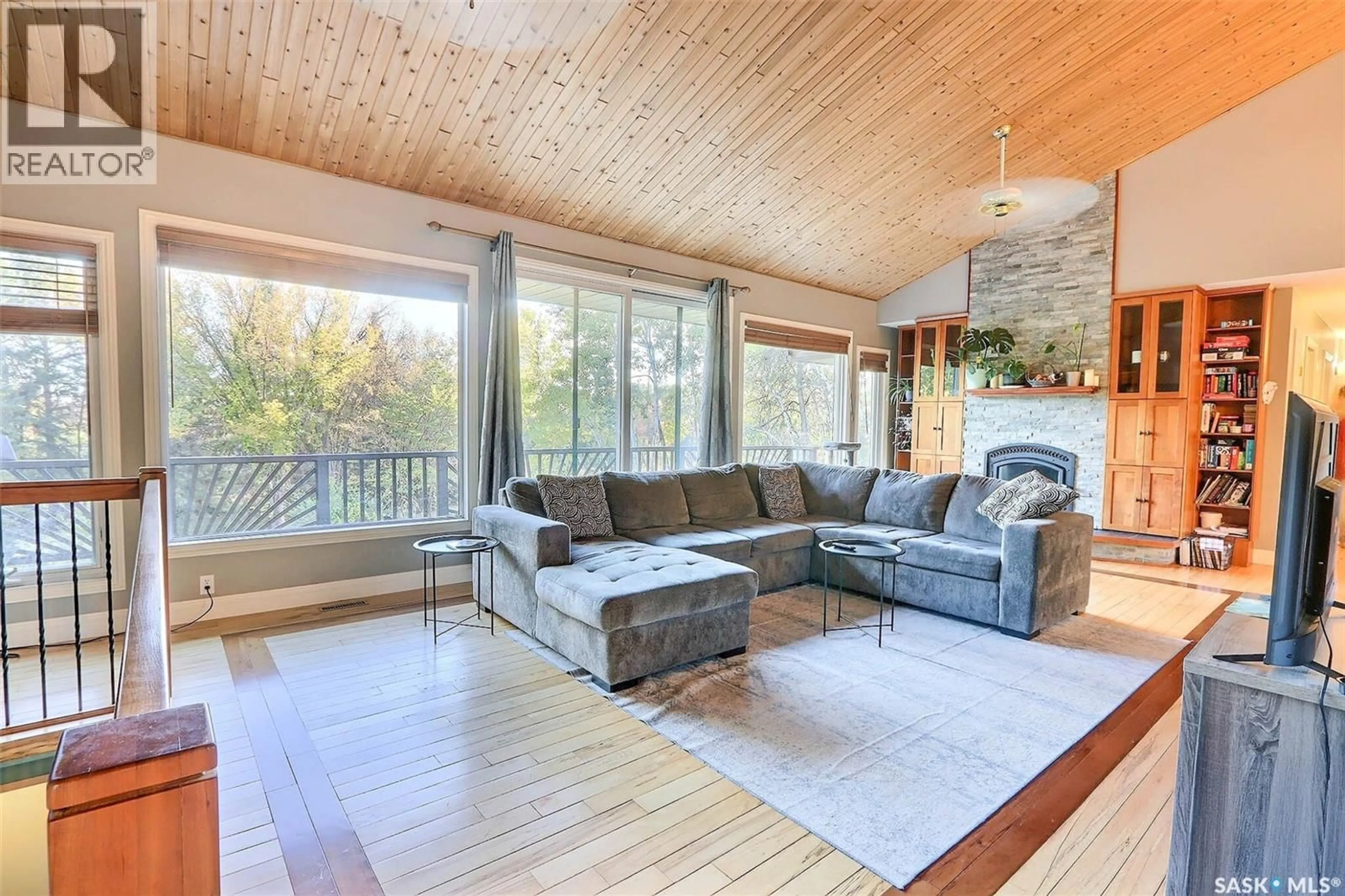 Living room with furniture, wood/laminate floor for 358 PINE DRIVE, Buckland Rm No. 491 Saskatchewan S6V5R3