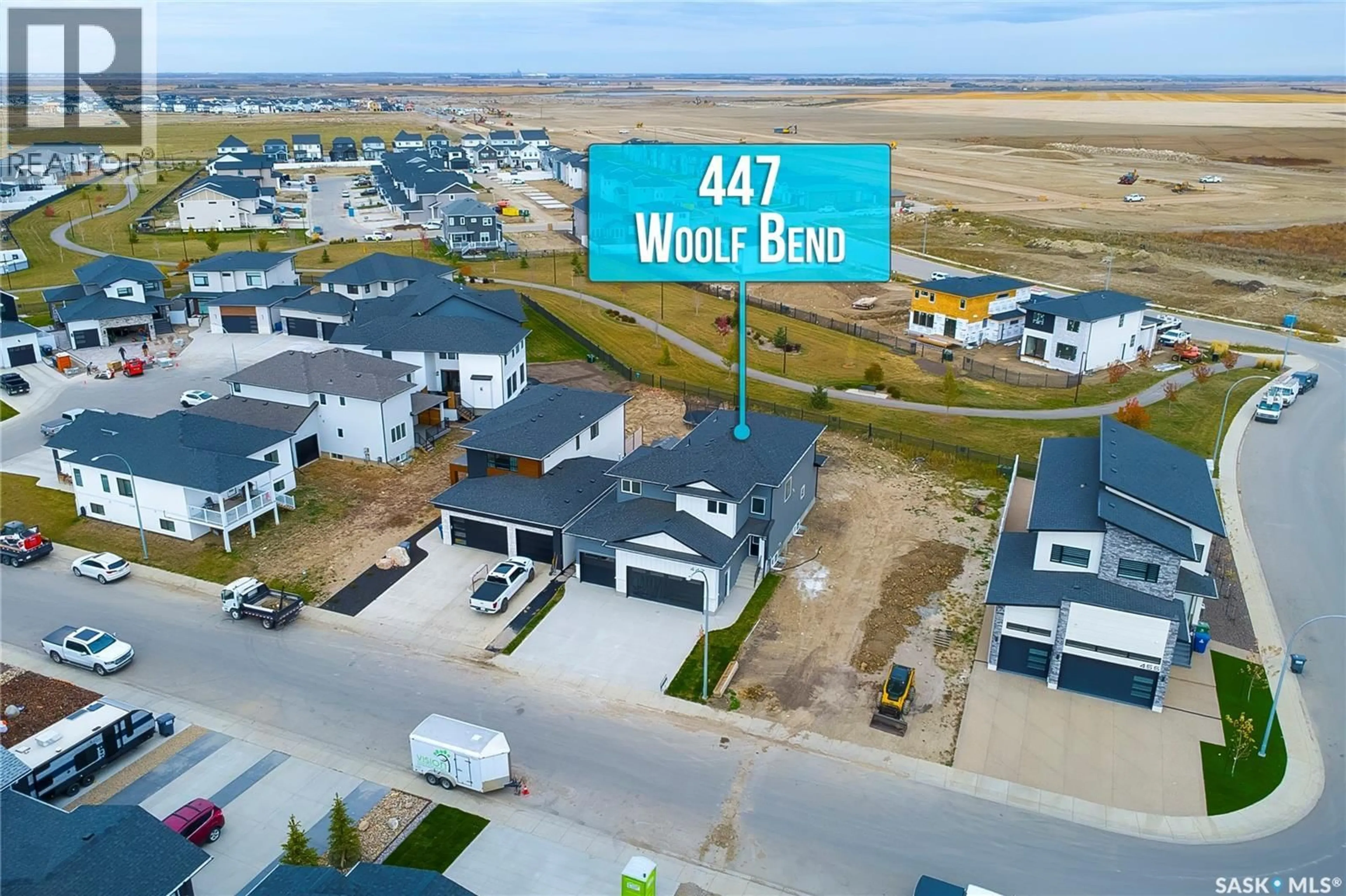 A pic from outside/outdoor area/front of a property/back of a property/a pic from drone, water/lake/river/ocean view for 447 WOOLF BEND, Saskatoon Saskatchewan S7W1E4