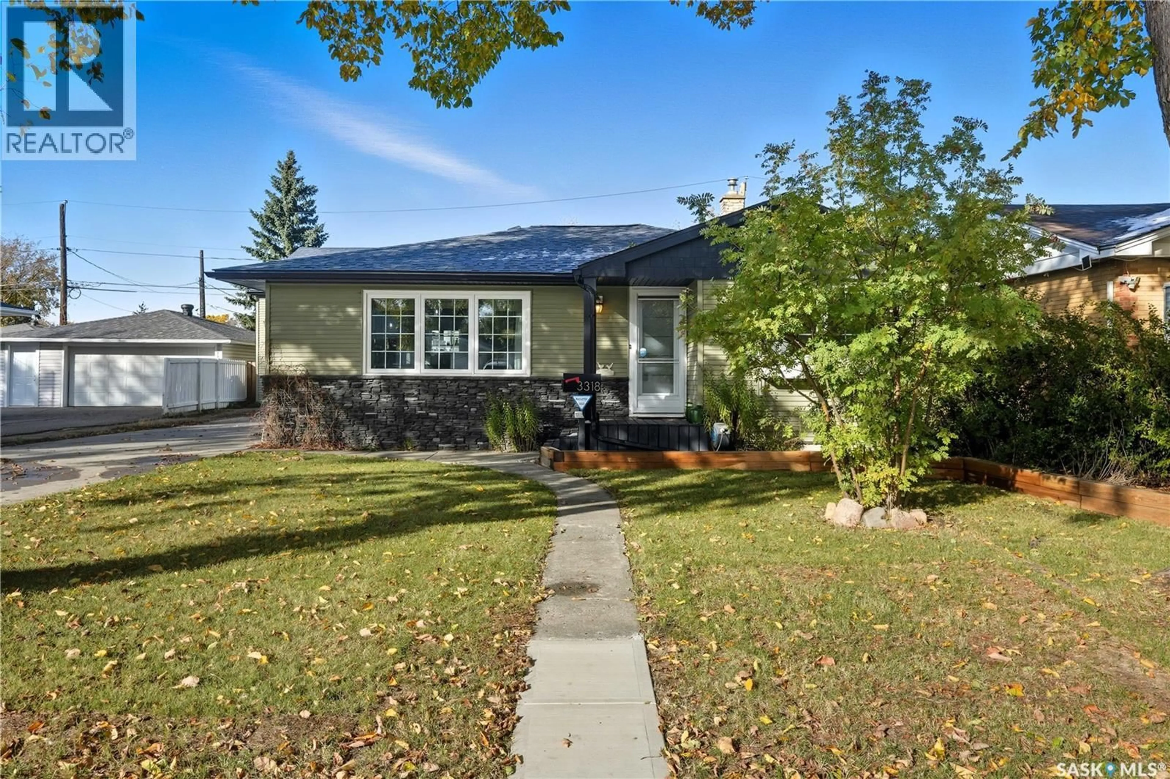 Home with vinyl exterior material, street for 3318 4TH AVENUE, Regina Saskatchewan S4R0V6