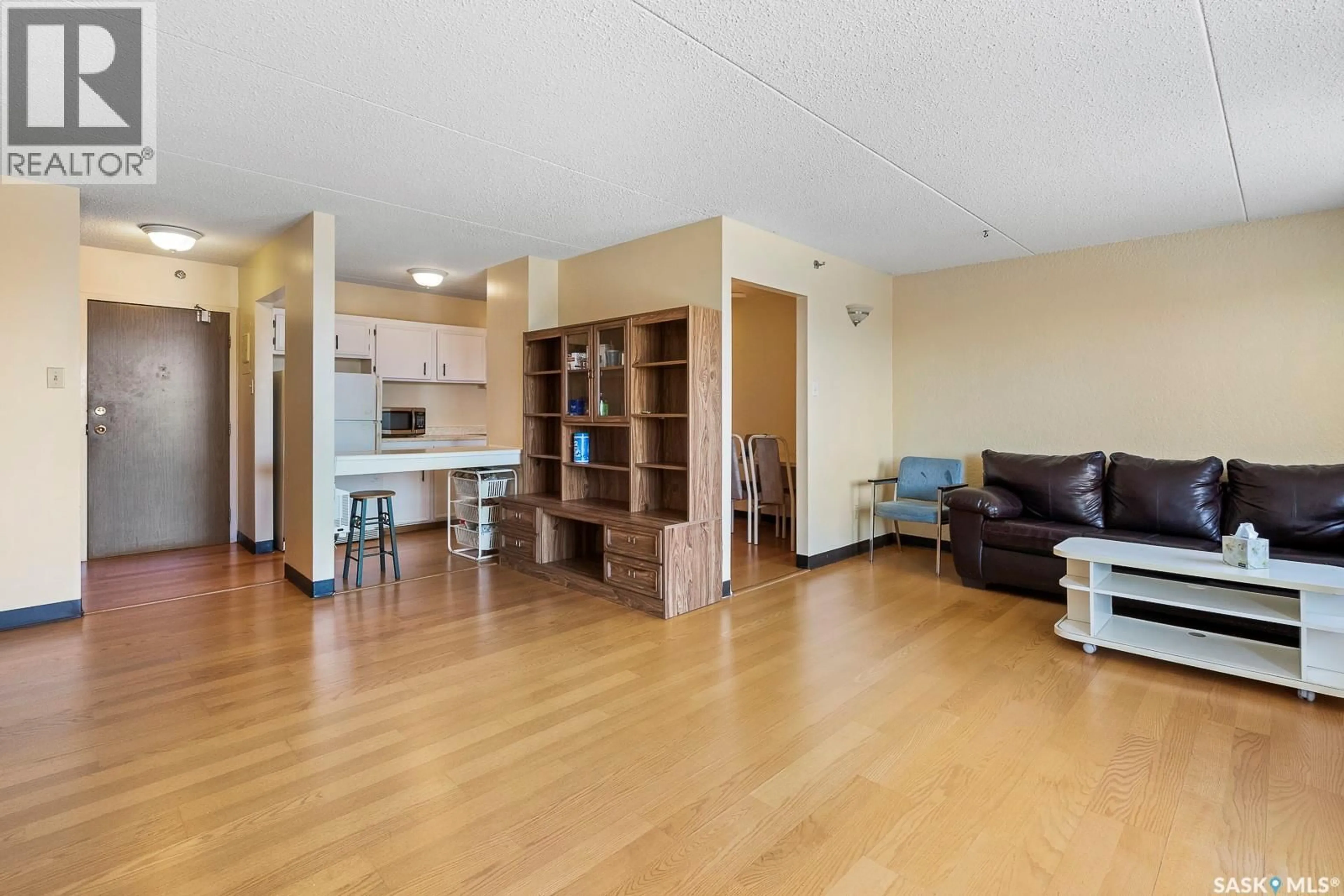 Living room with furniture, wood/laminate floor for 205 - 4045 RAE STREET, Regina Saskatchewan S4S6Y8