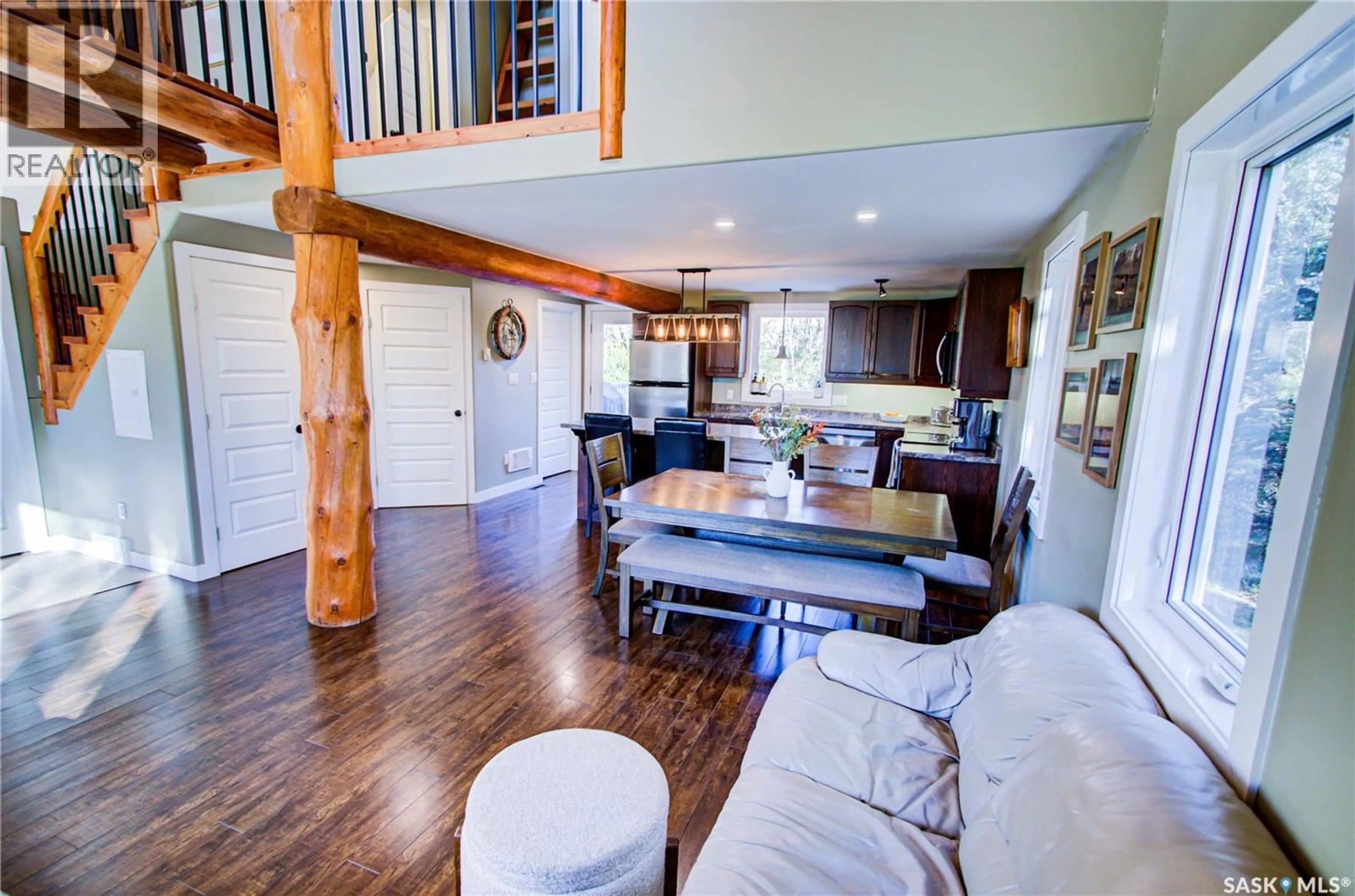 Living room with furniture, wood/laminate floor for 437 2ND STREET, Beatty Saskatchewan S0J0C0