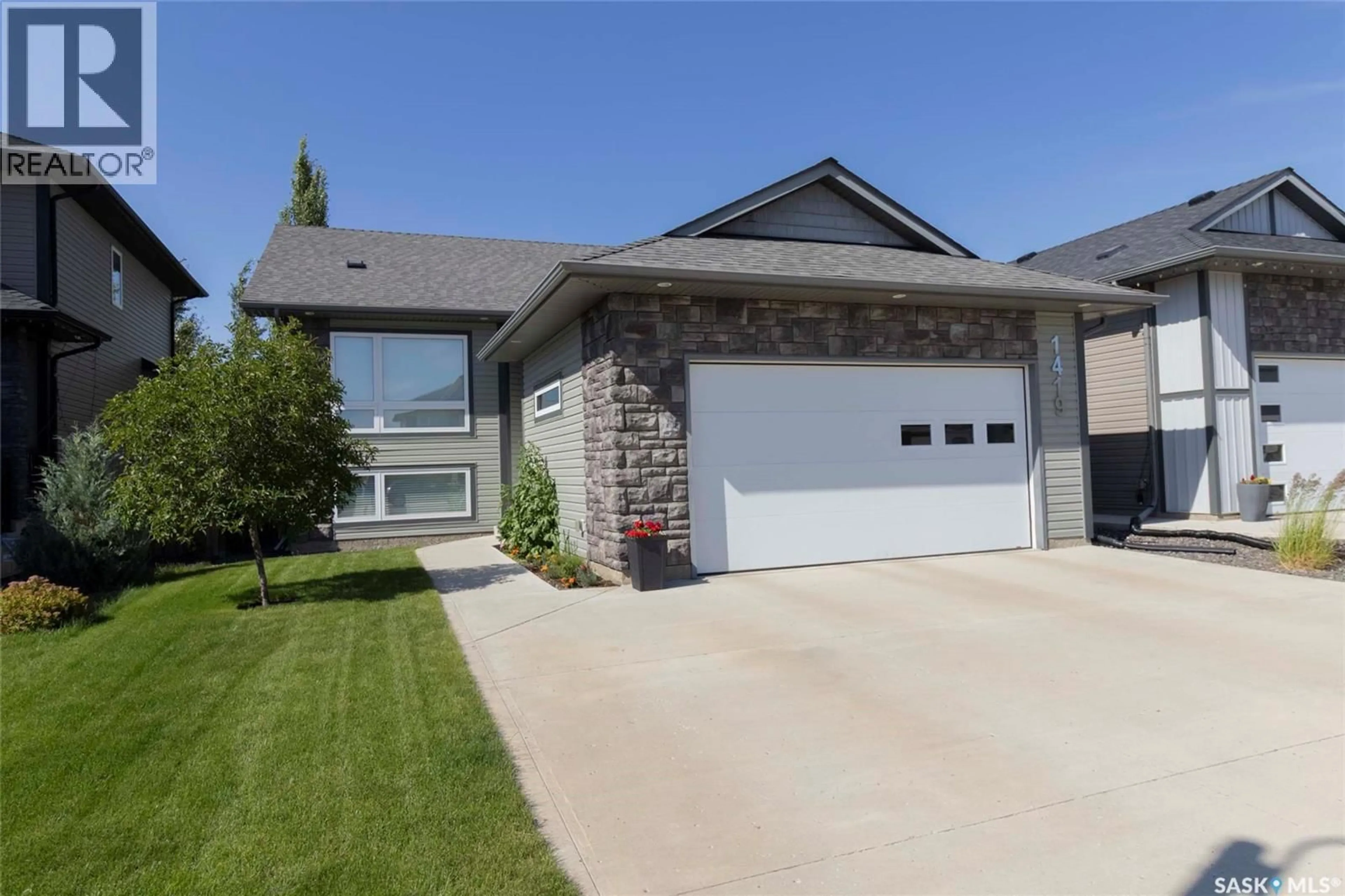 Home with vinyl exterior material, street for 1419 PRINGLE CRESCENT, Saskatoon Saskatchewan S7T0S6