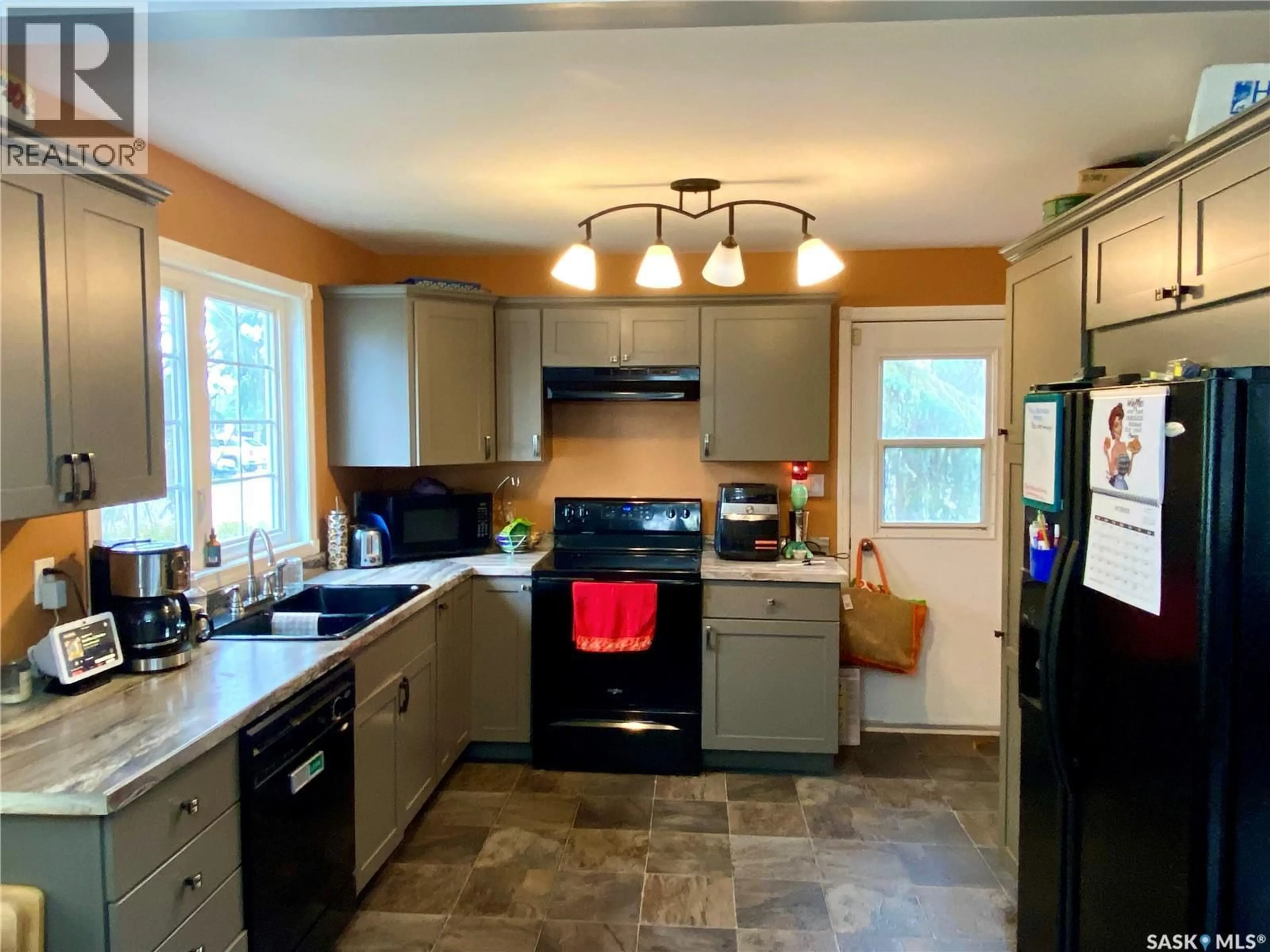 Open concept kitchen, ceramic/tile floor for E - 204 4TH STREET, Carnduff Saskatchewan S0C0S0