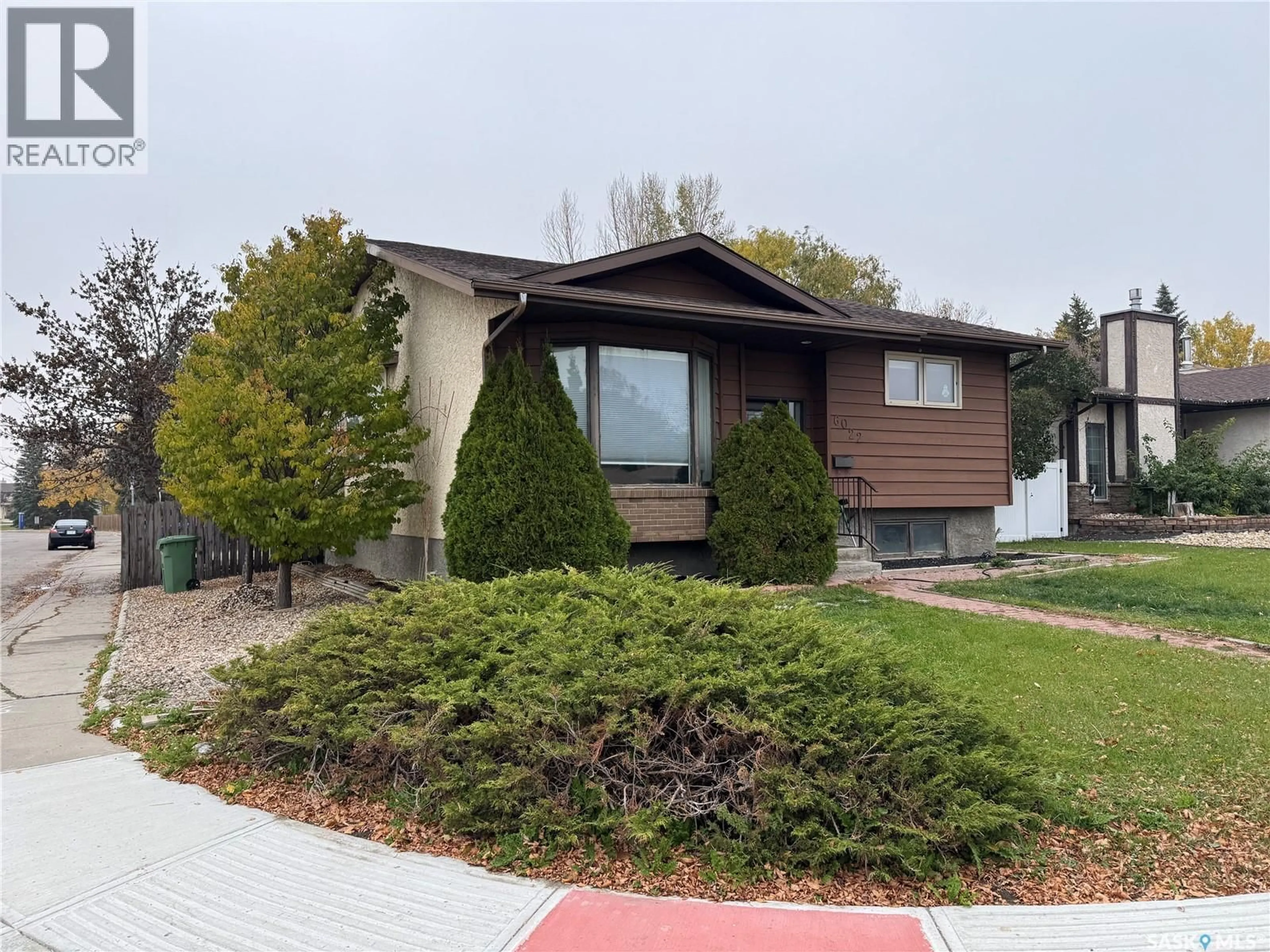 Home with vinyl exterior material, street for 6022 WADGE STREET, Regina Saskatchewan S4X4B5