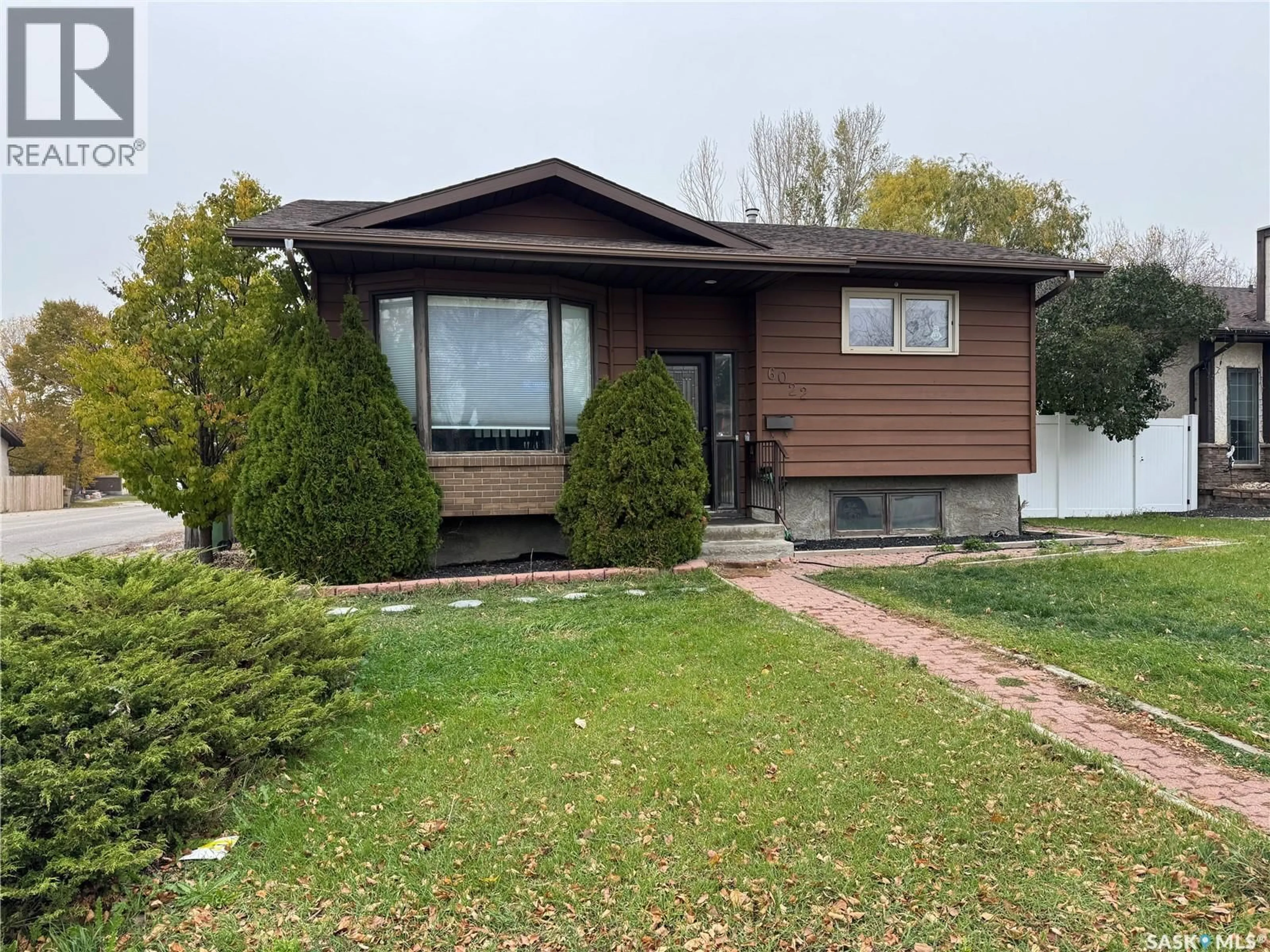 Home with vinyl exterior material, street for 6022 WADGE STREET, Regina Saskatchewan S4X4B5