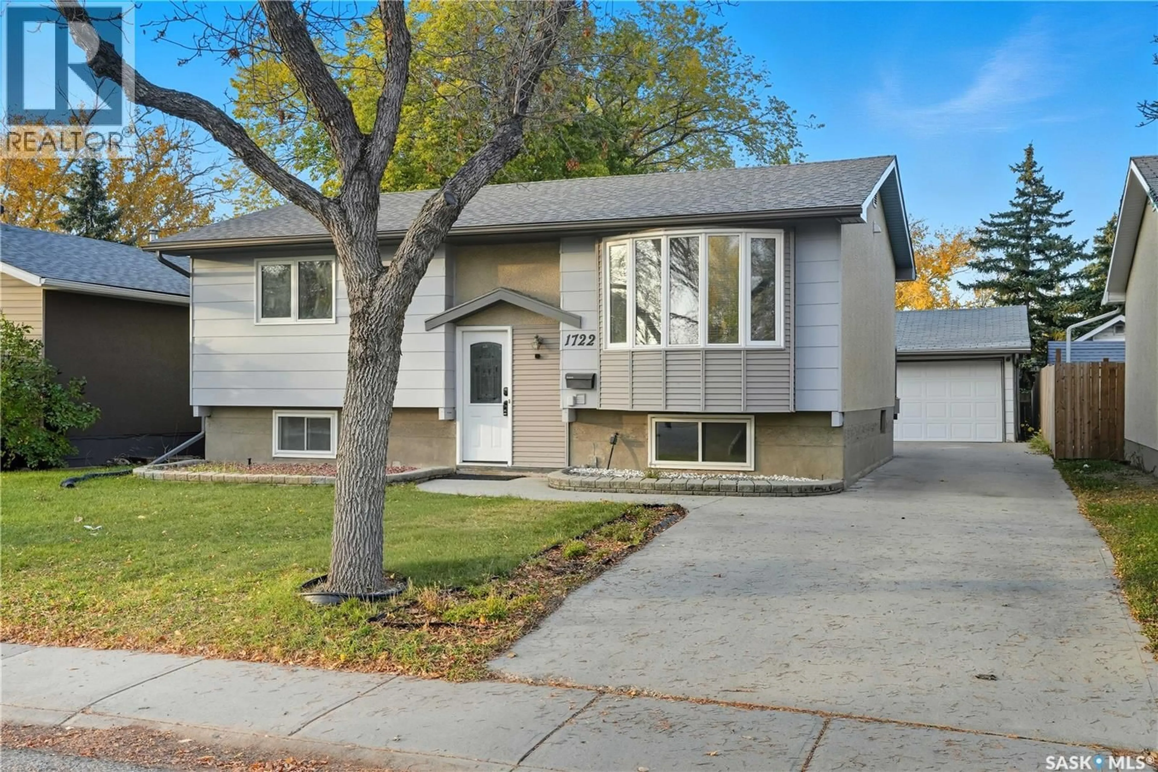 Home with vinyl exterior material, street for 1722 7TH AVENUE, Regina Saskatchewan S4N4H1