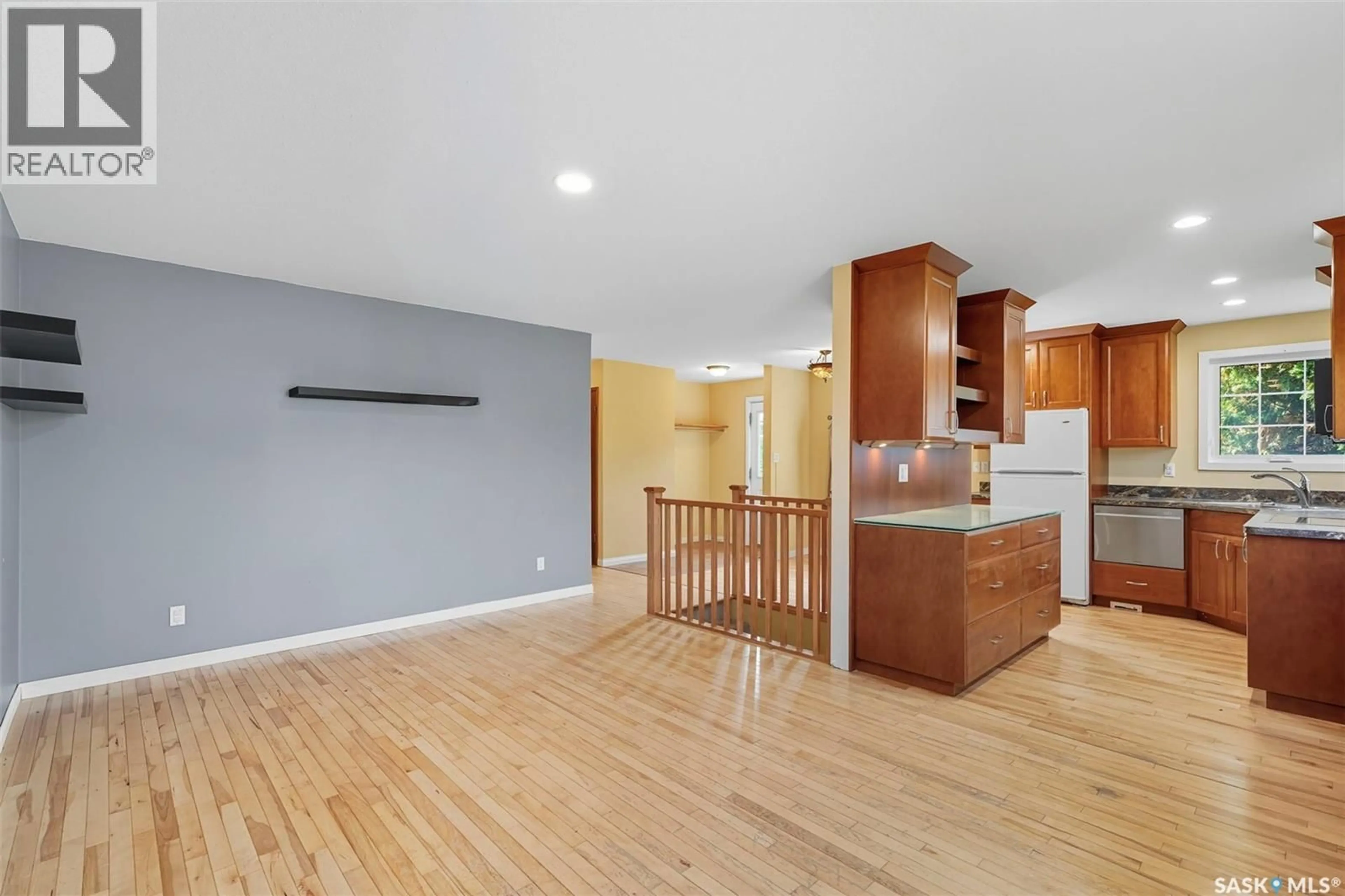 Open concept kitchen, wood/laminate floor for 97 ARNASON CRESCENT, Saskatoon Saskatchewan S7H4M7