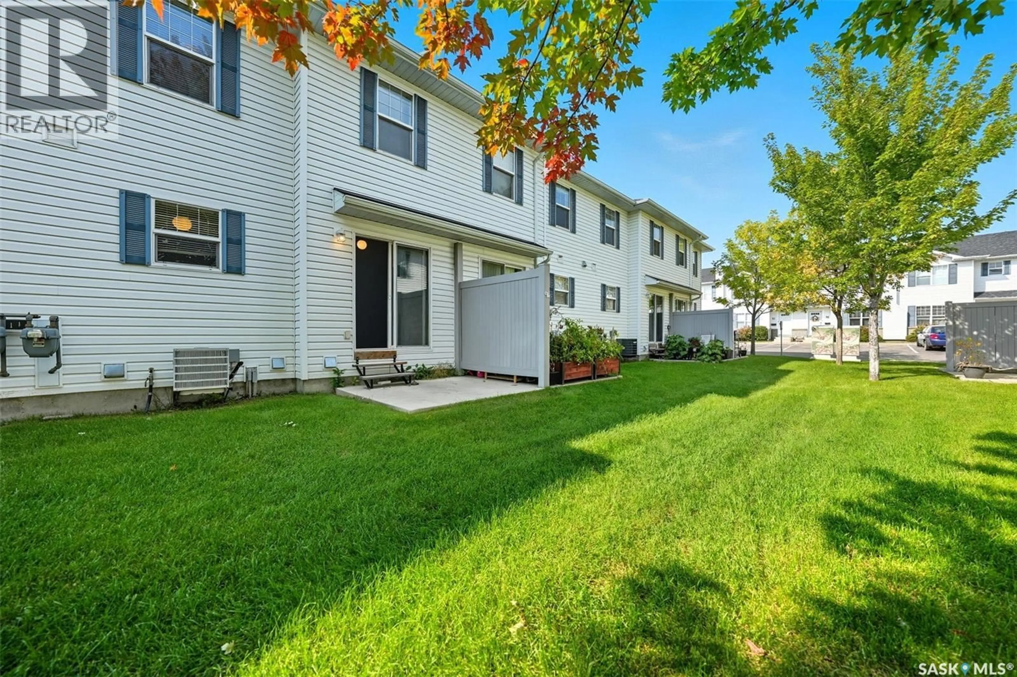 Home with vinyl exterior material, street for 65 203 HEROLD TERRACE, Saskatoon Saskatchewan S7V1H5