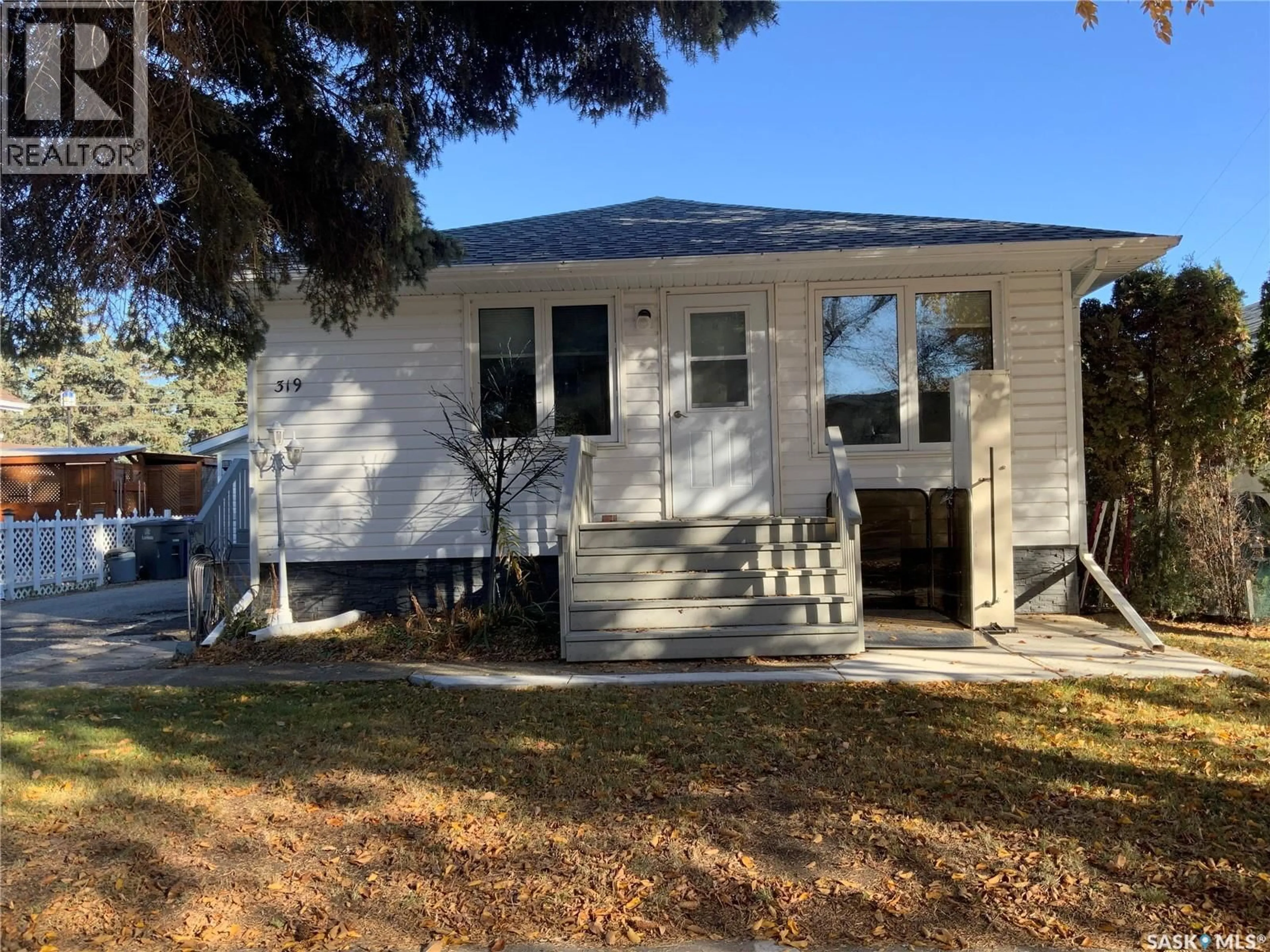 Home with vinyl exterior material, street for 319 SIMPSON STREET, Outlook Saskatchewan S0L2N0