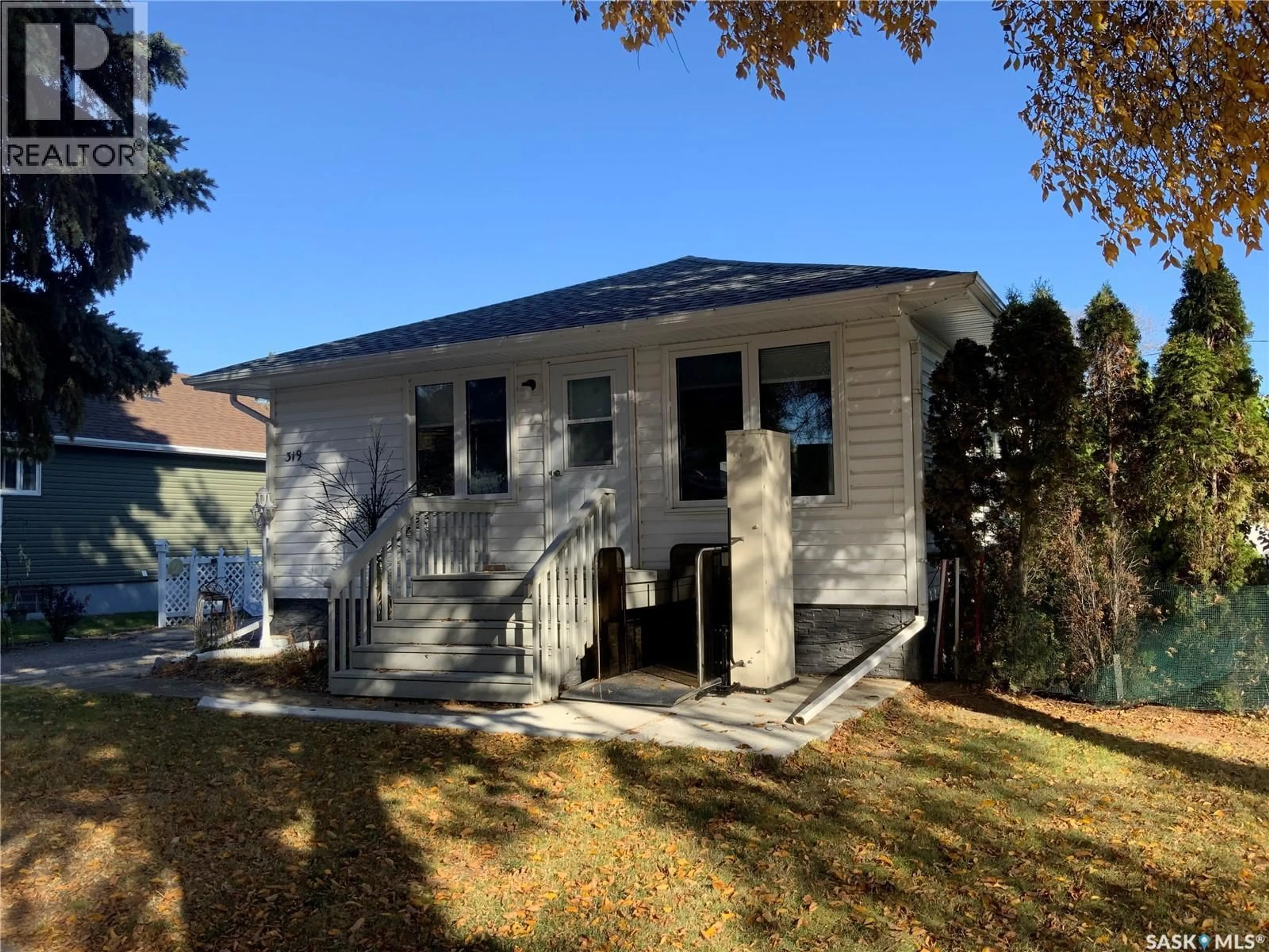 Home with vinyl exterior material, street for 319 SIMPSON STREET, Outlook Saskatchewan S0L2N0