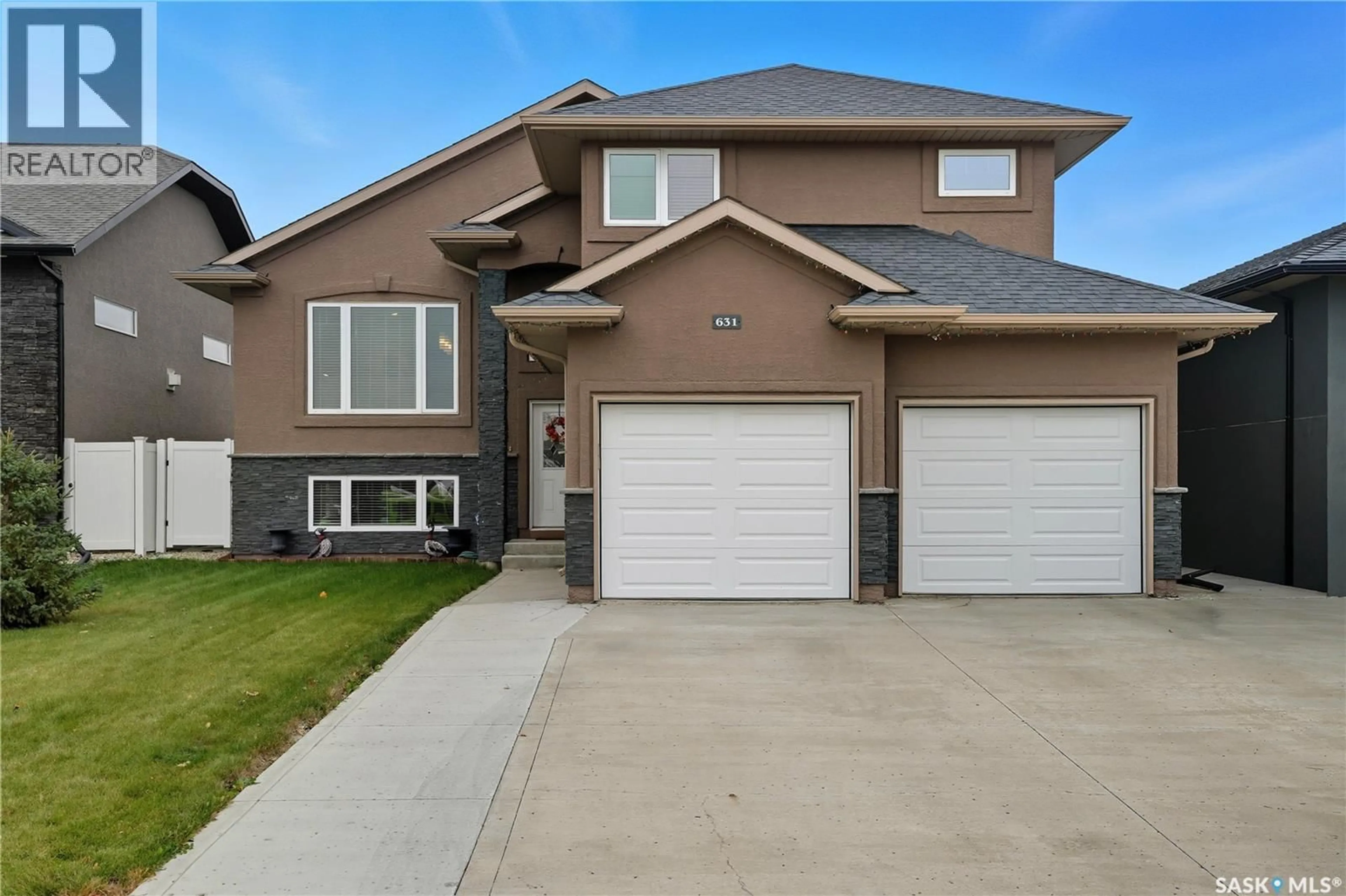 Home with vinyl exterior material, street for 631 LEDINGHAM CRESCENT, Saskatoon Saskatchewan S7V0B6