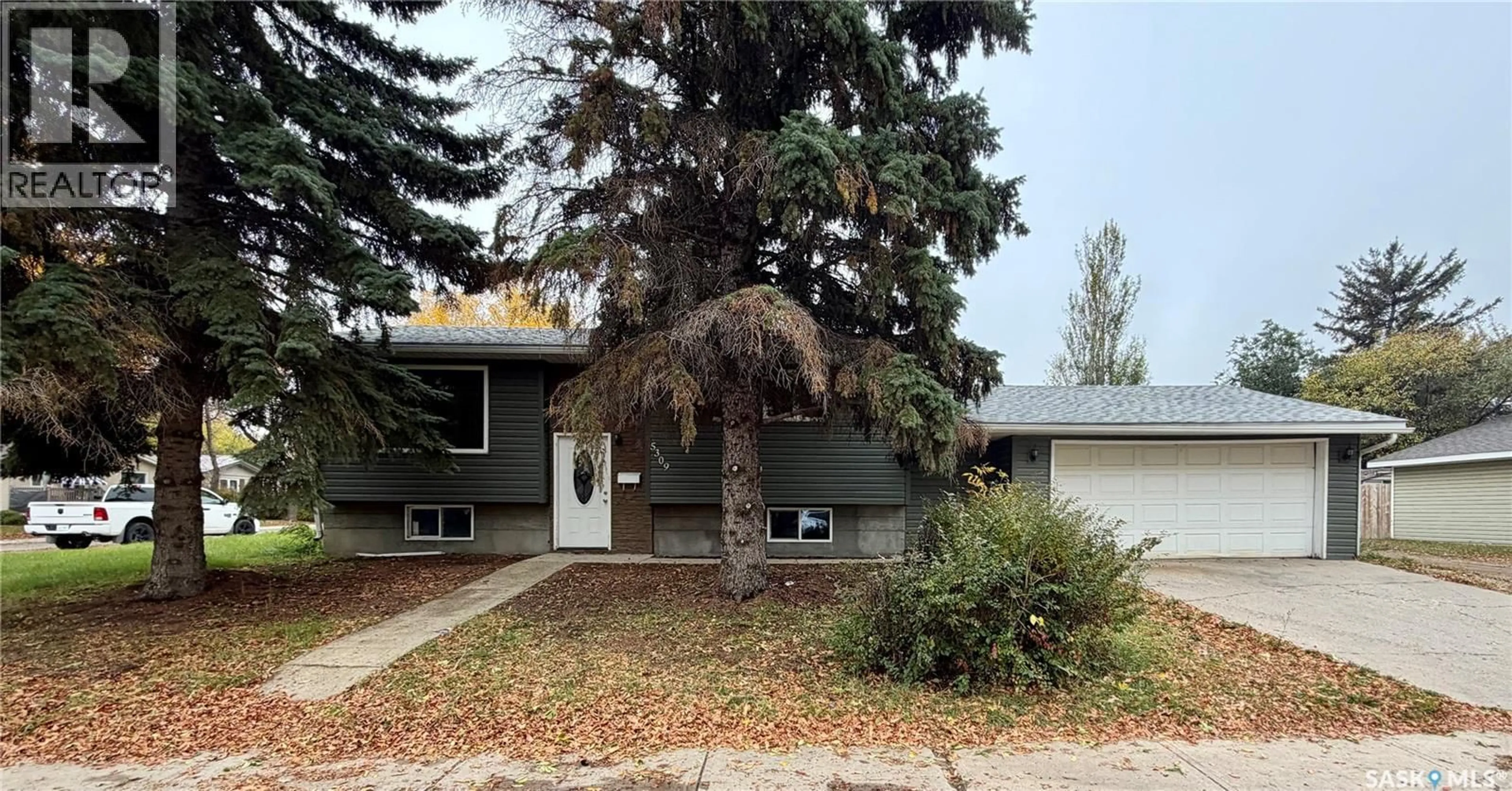 Home with vinyl exterior material, street for 5309 2ND AVENUE, Regina Saskatchewan S4R0Z5