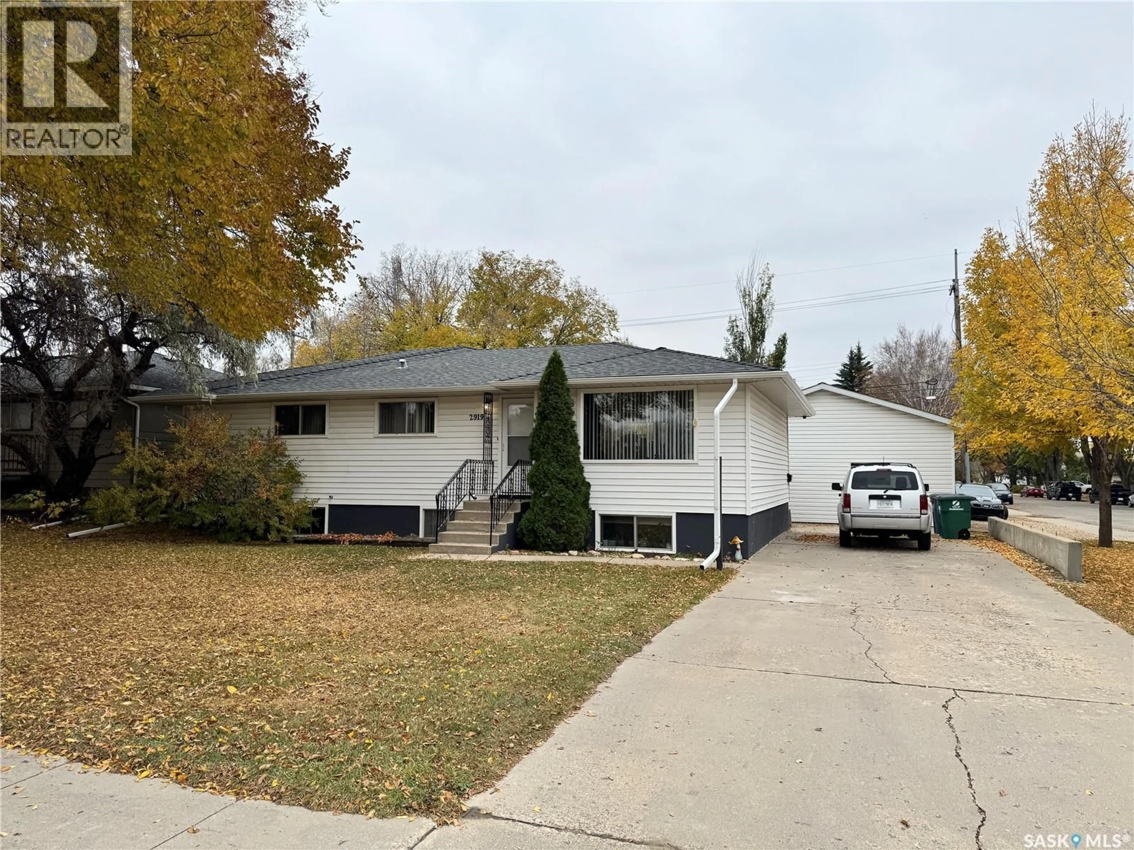Home with vinyl exterior material, street for 2919 20TH STREET, Saskatoon Saskatchewan S7M1C2