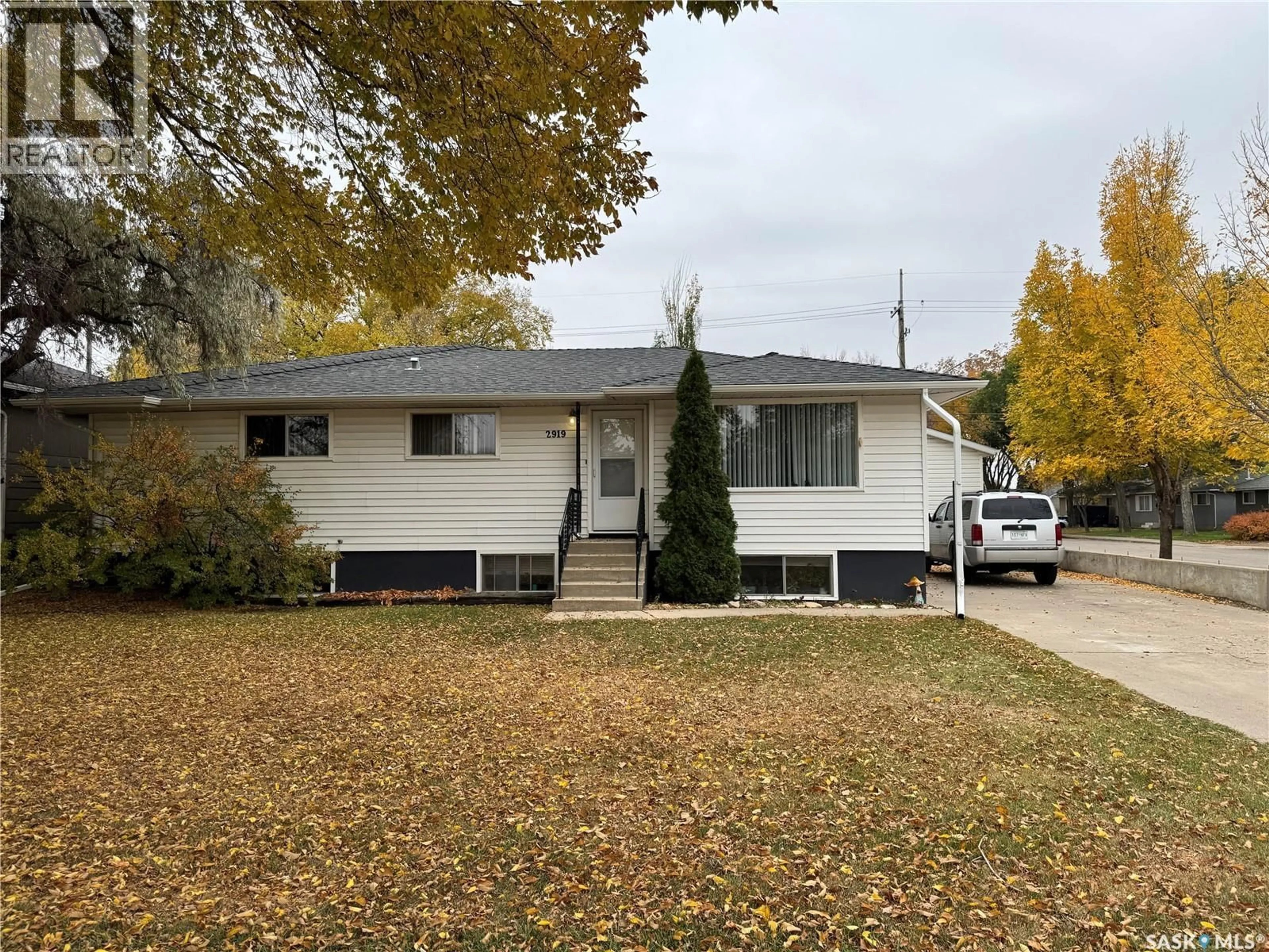 Home with vinyl exterior material, street for 2919 20TH STREET, Saskatoon Saskatchewan S7M1C2