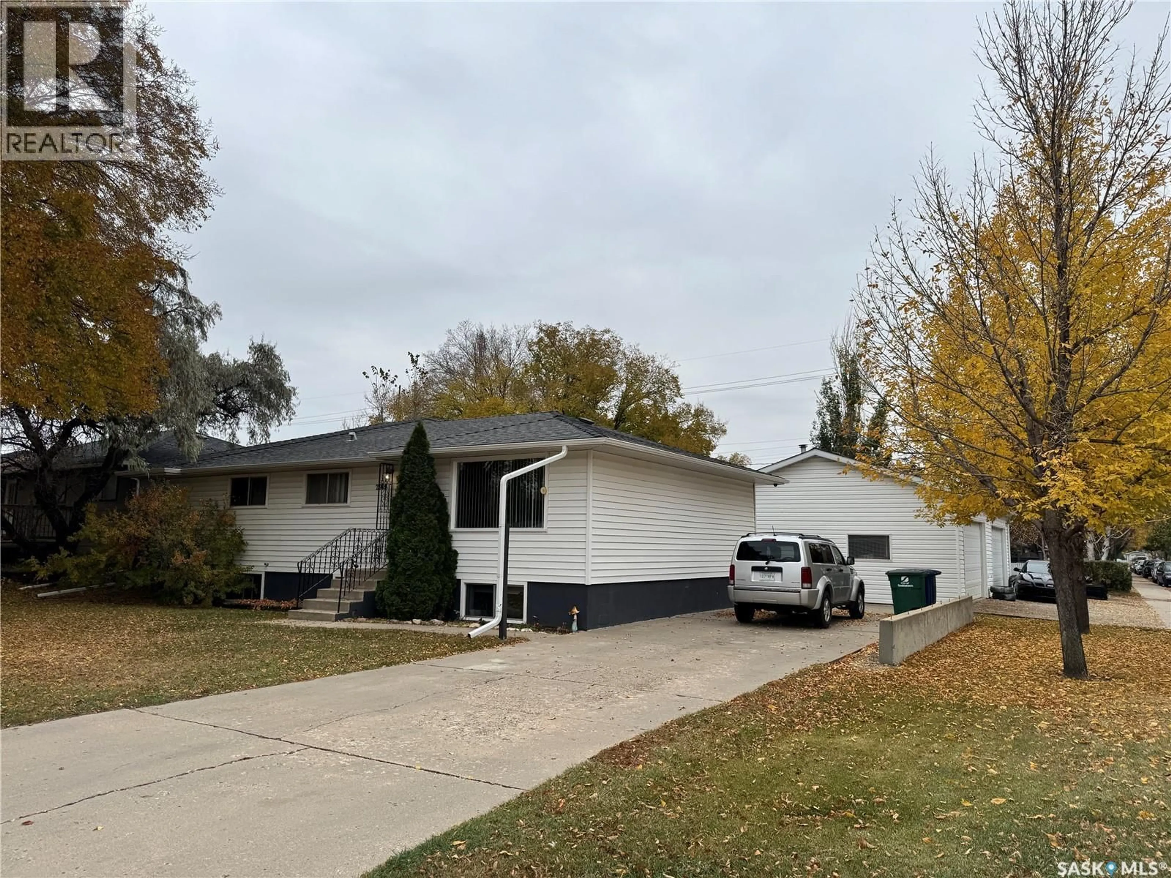 Home with vinyl exterior material, street for 2919 20TH STREET, Saskatoon Saskatchewan S7M1C2