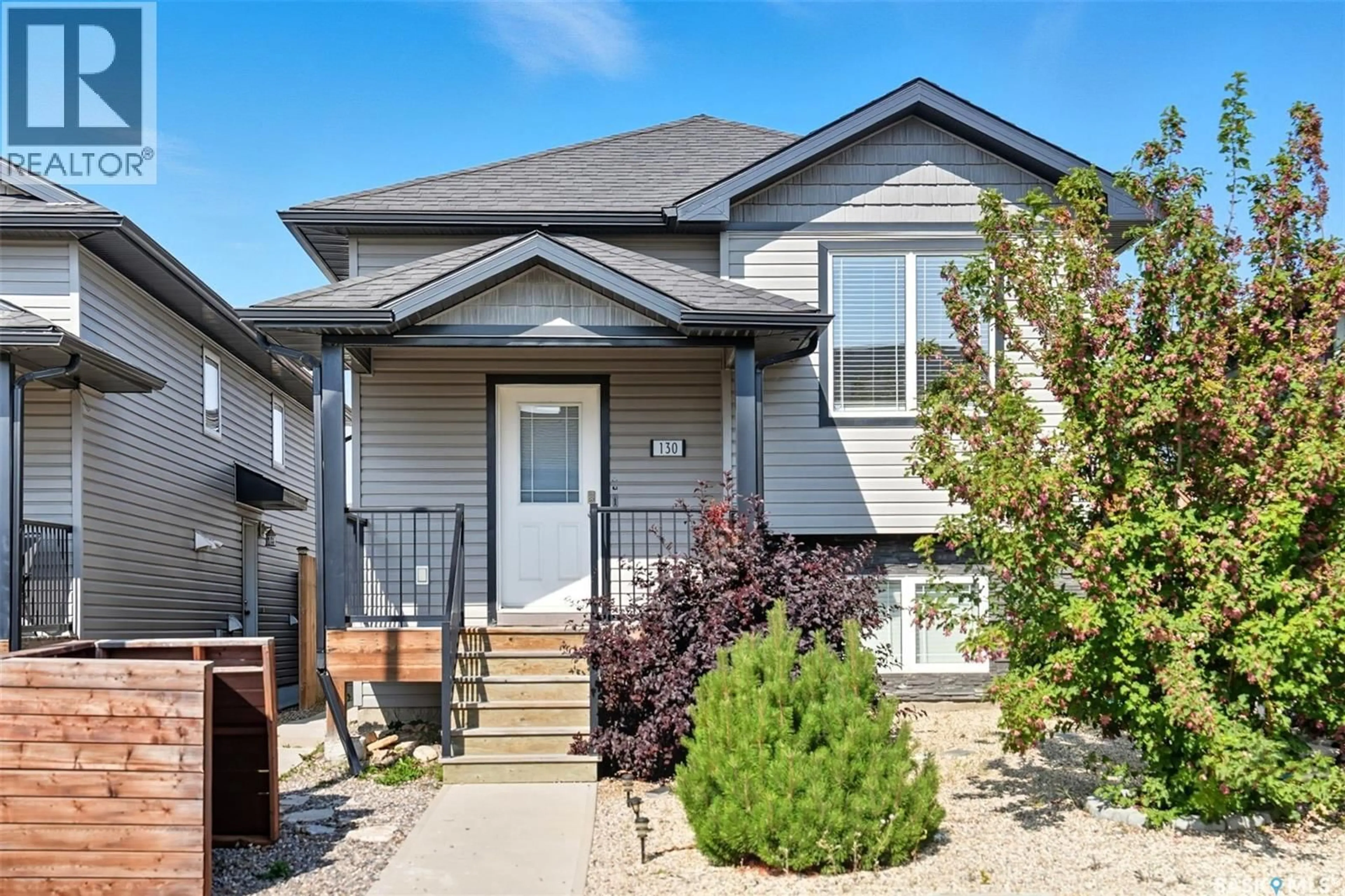 Home with vinyl exterior material, street for 130 WYANT LANE, Saskatoon Saskatchewan S7W0N8