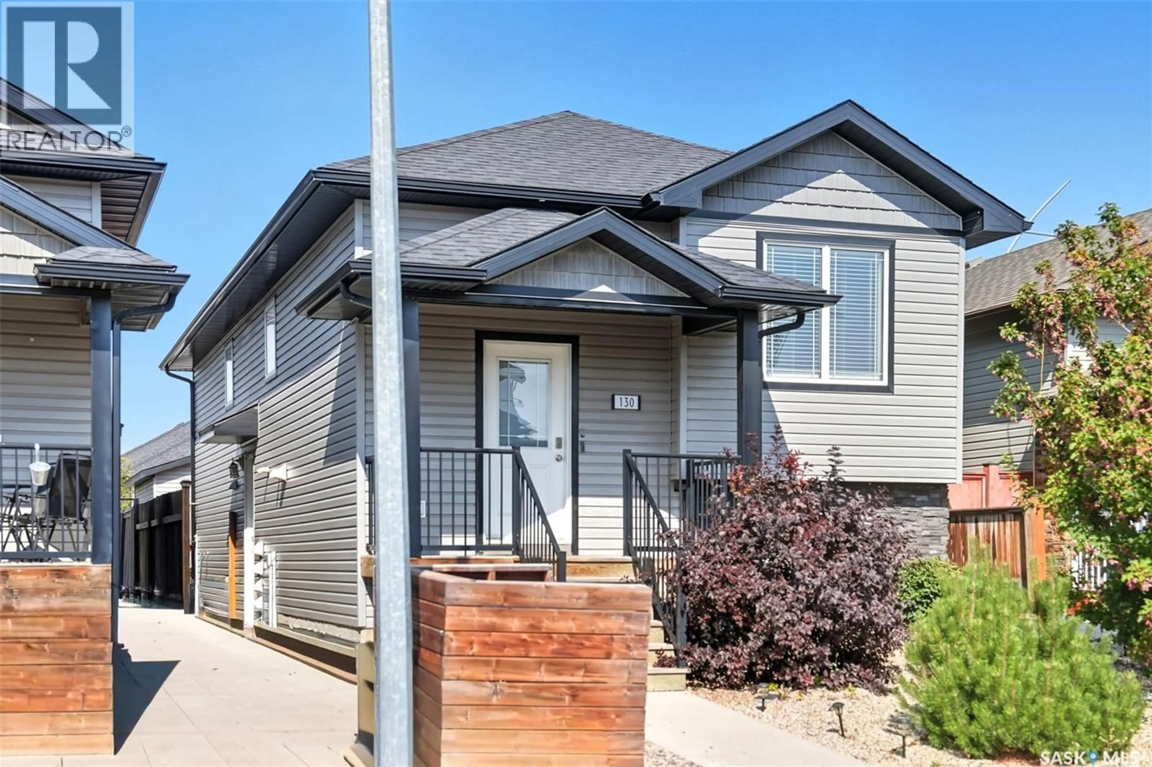 Home with brick exterior material, street for 130 WYANT LANE, Saskatoon Saskatchewan S7W0N8