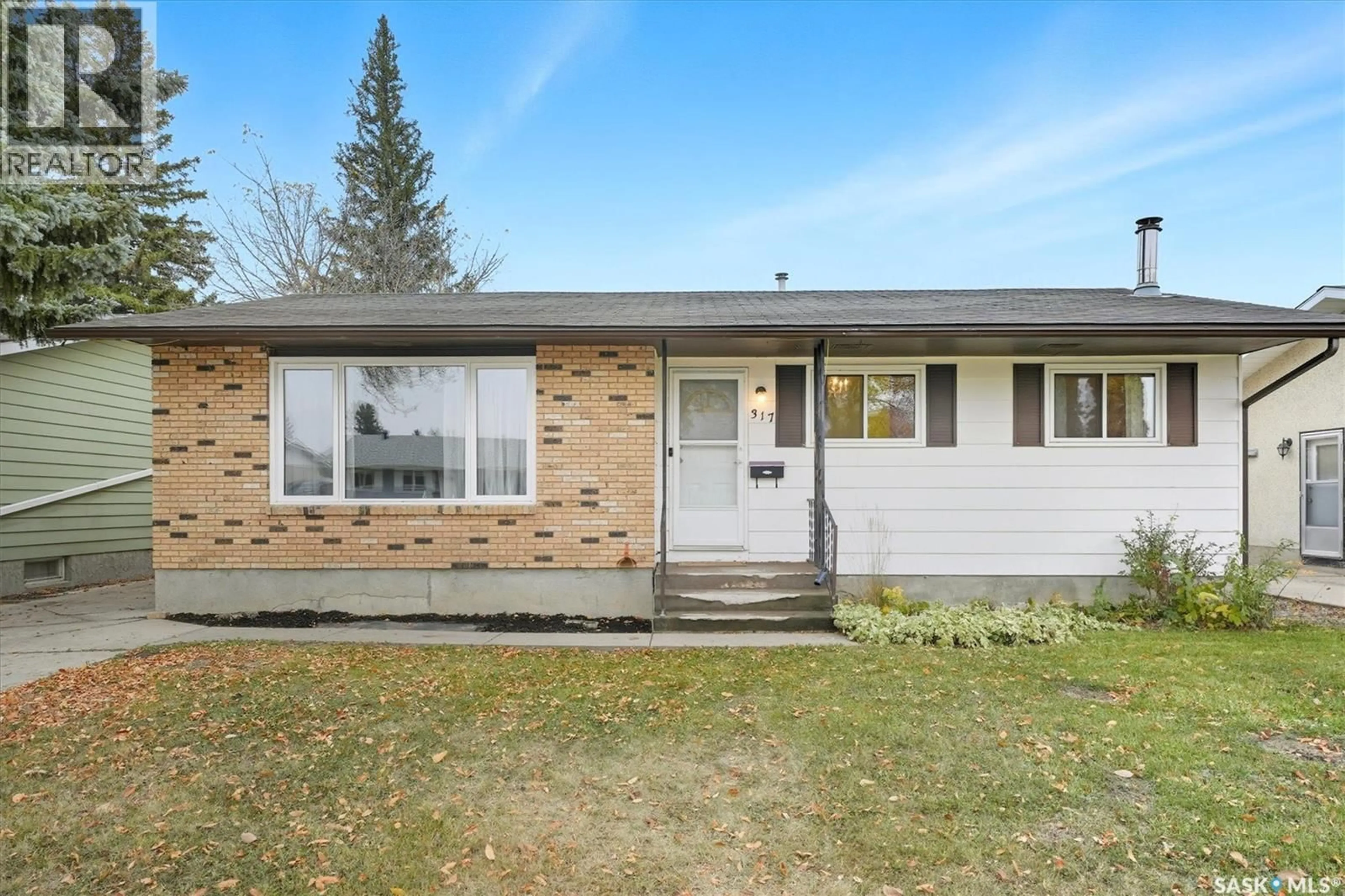 Home with vinyl exterior material, street for 317 FISHER CRESCENT, Saskatoon Saskatchewan S7L5E1