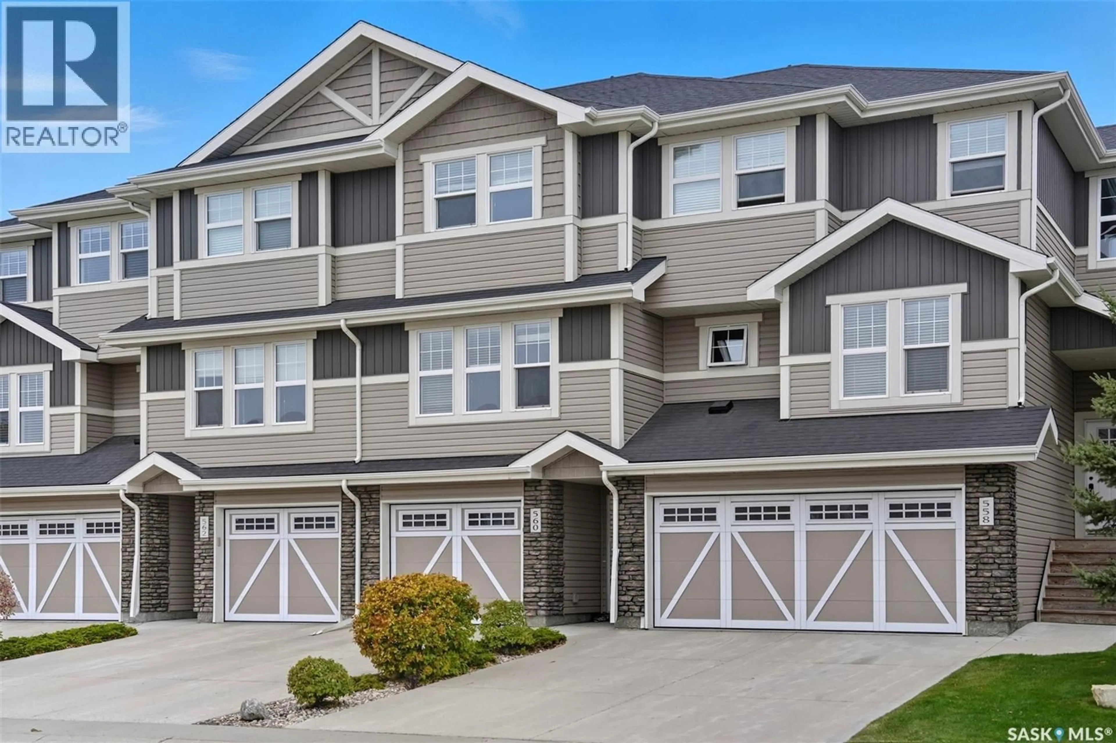 Home with vinyl exterior material, street for 560 PRINGLE CRESCENT, Saskatoon Saskatchewan S7T0W9