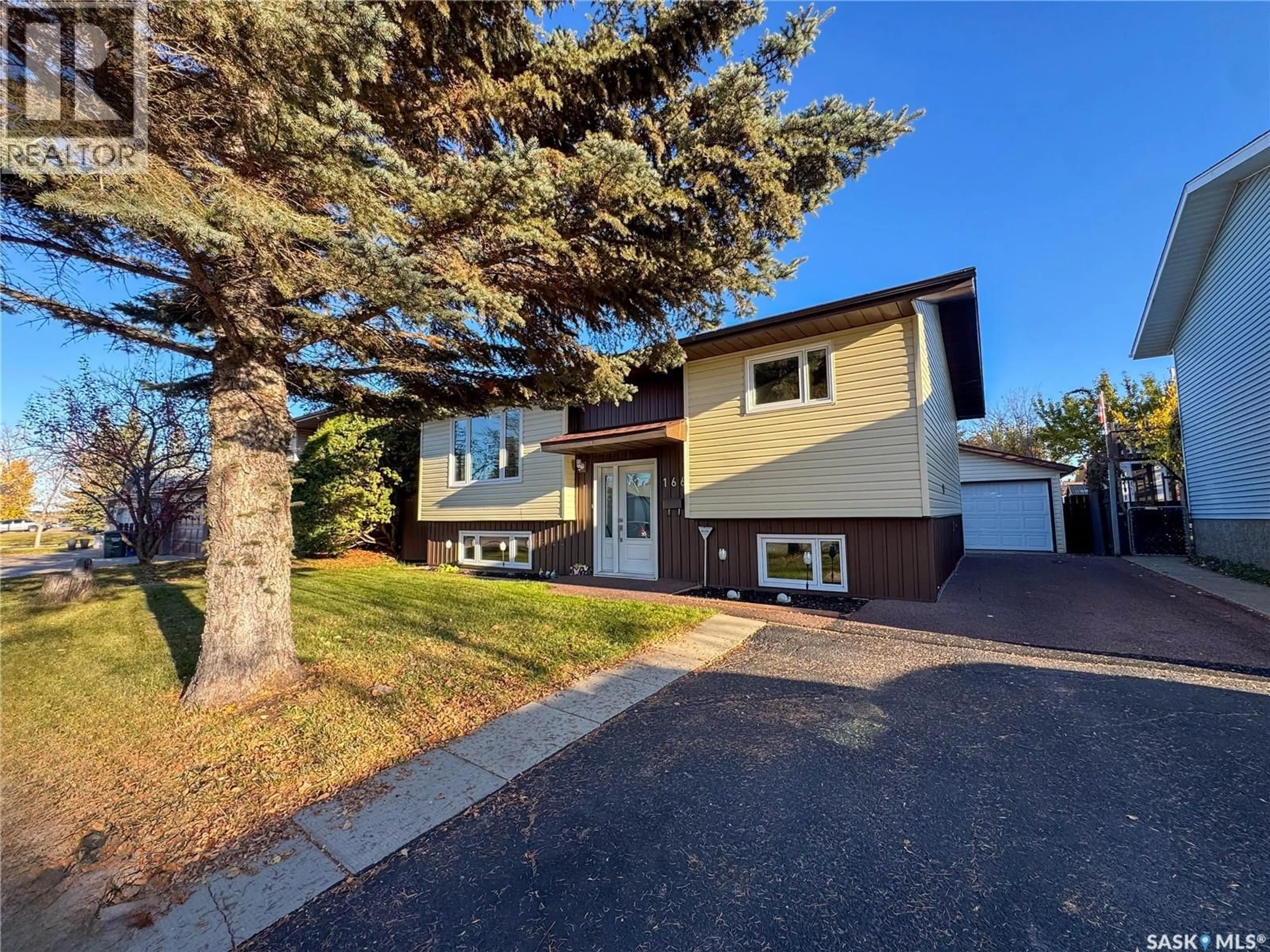 Home with vinyl exterior material, street for 1661 OLIVE DIEFENBAKER DRIVE, Prince Albert Saskatchewan S6V7V9