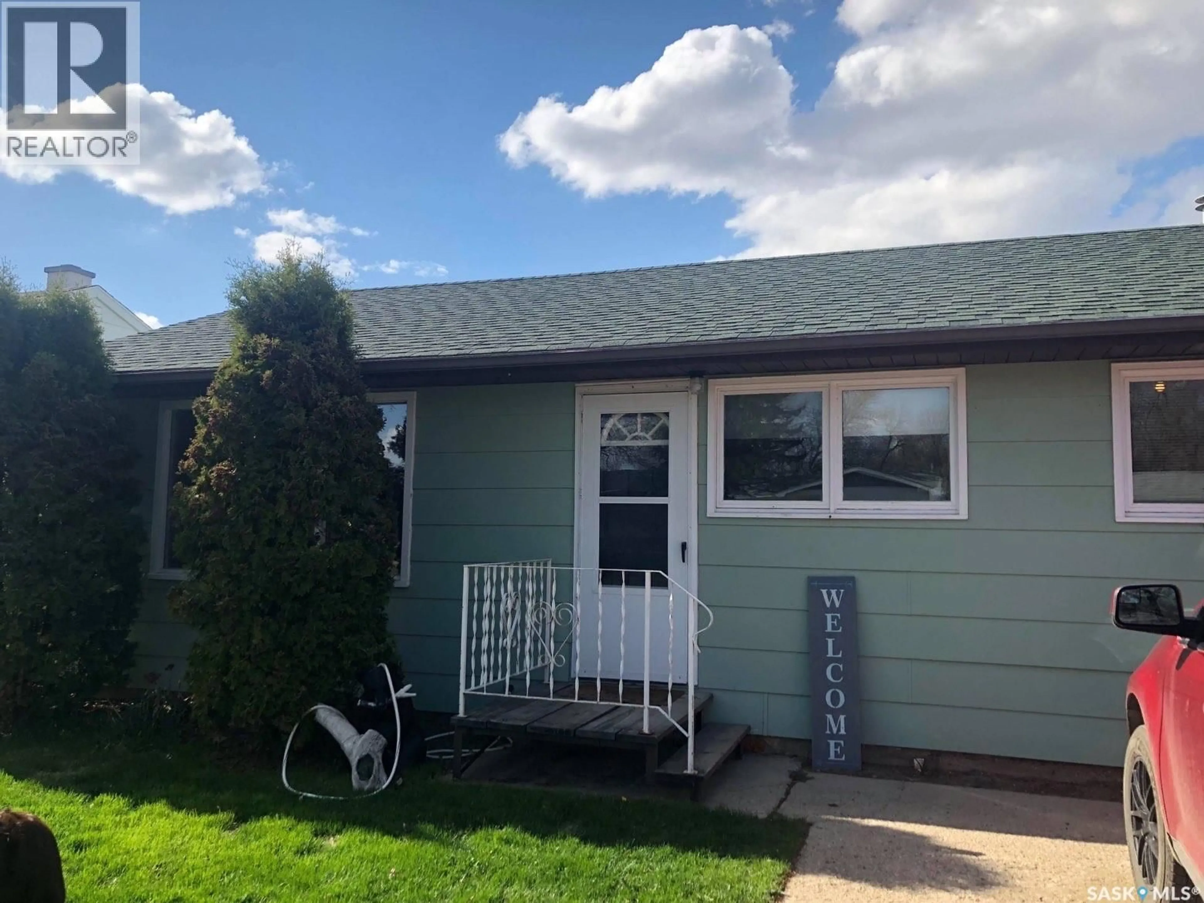 Home with vinyl exterior material, street for 310 DOMINION ROAD, Assiniboia Saskatchewan S0H0B0