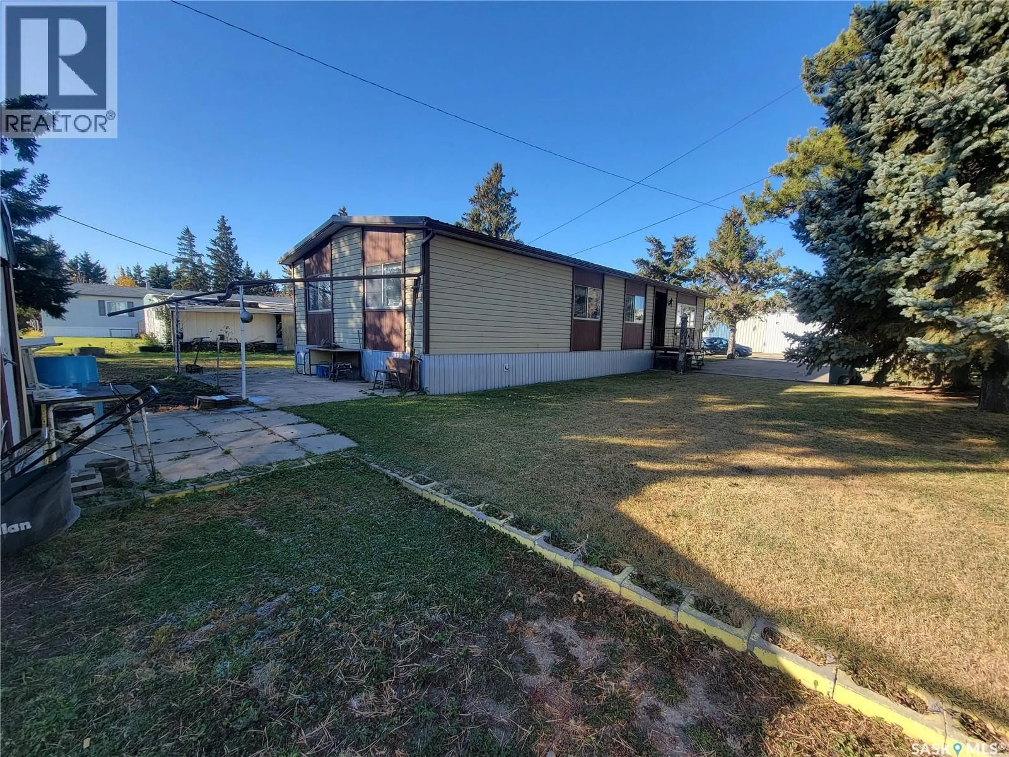A pic from outside/outdoor area/front of a property/back of a property/a pic from drone, building for 310 5TH STREET, Wilkie Saskatchewan S0L2C0