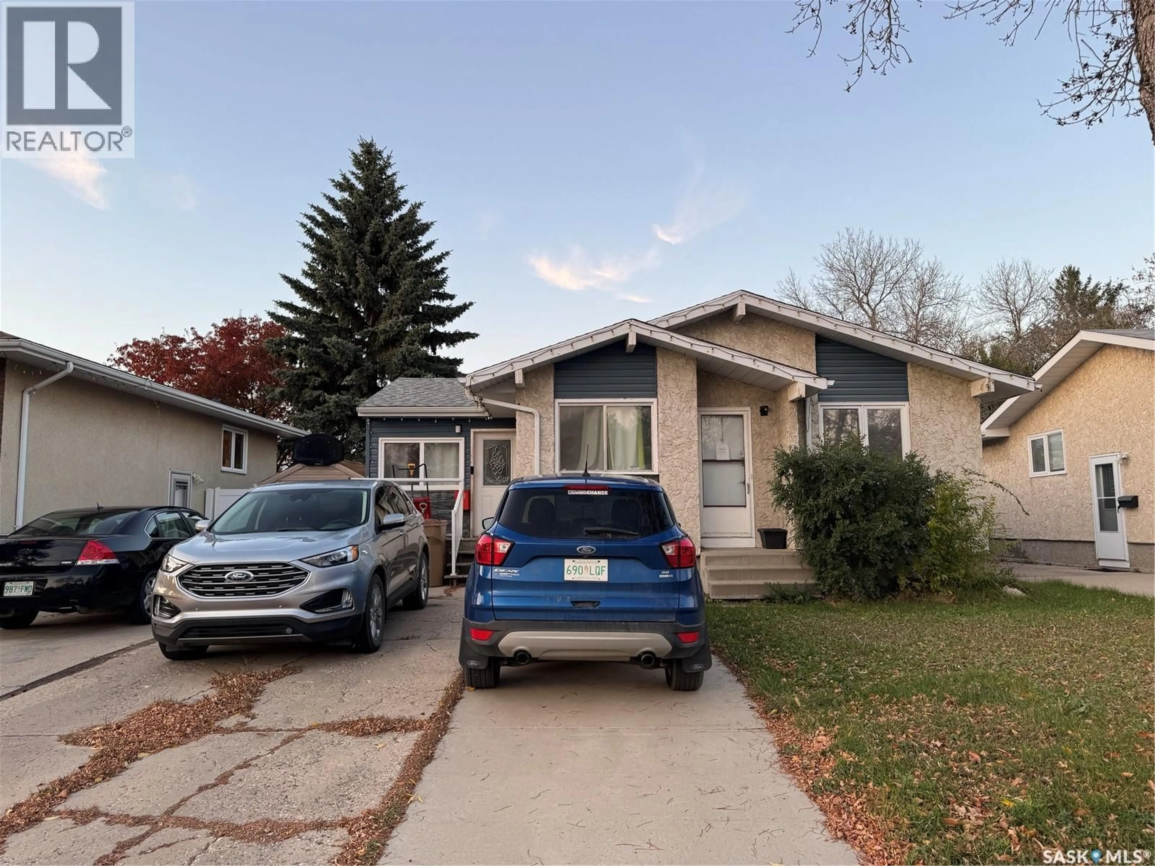 Home with vinyl exterior material, street for 138 THOMSON AVENUE, Regina Saskatchewan S4N5L3