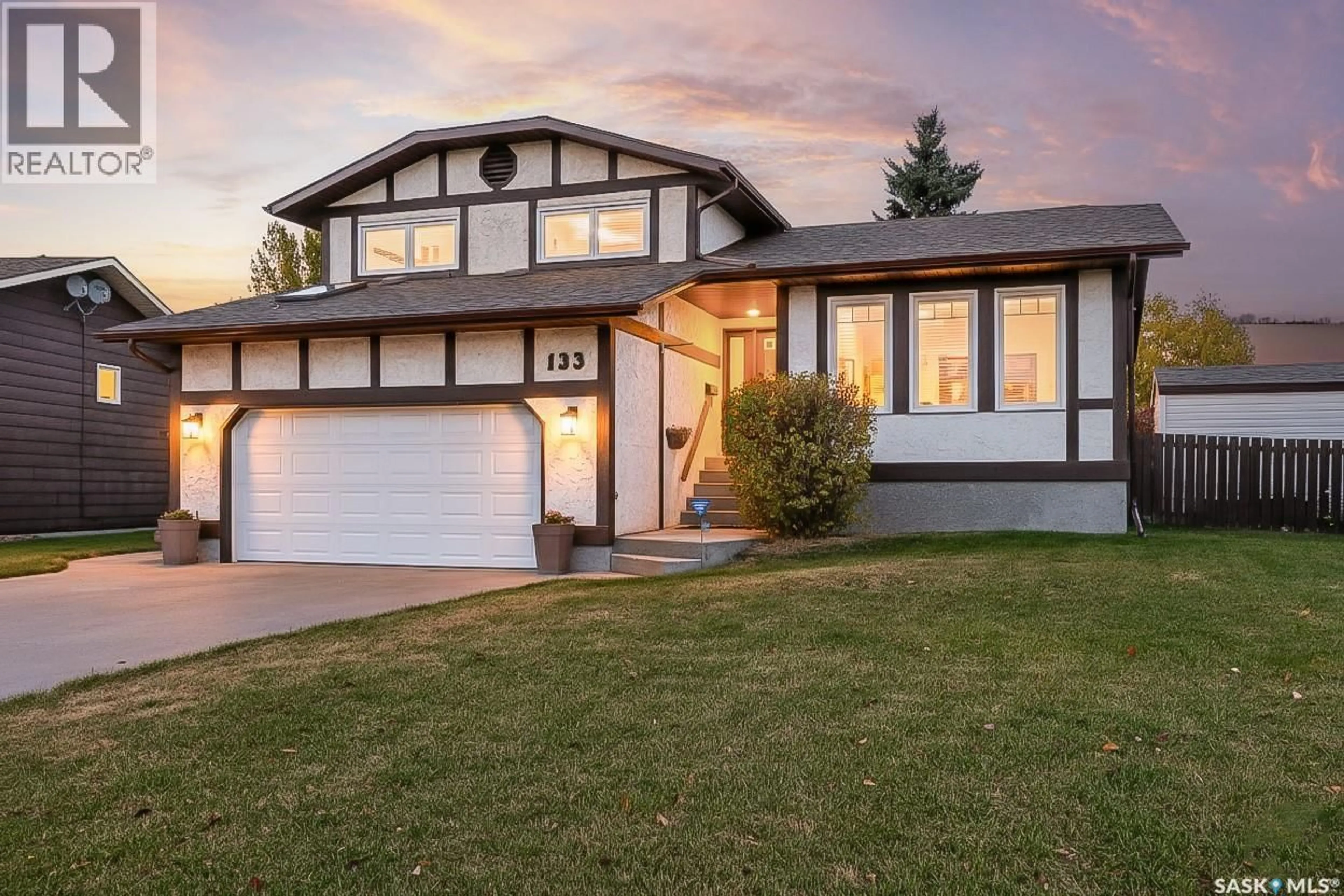 Home with vinyl exterior material, street for 133 WOOD LILY DRIVE, Moose Jaw Saskatchewan S6J1E9