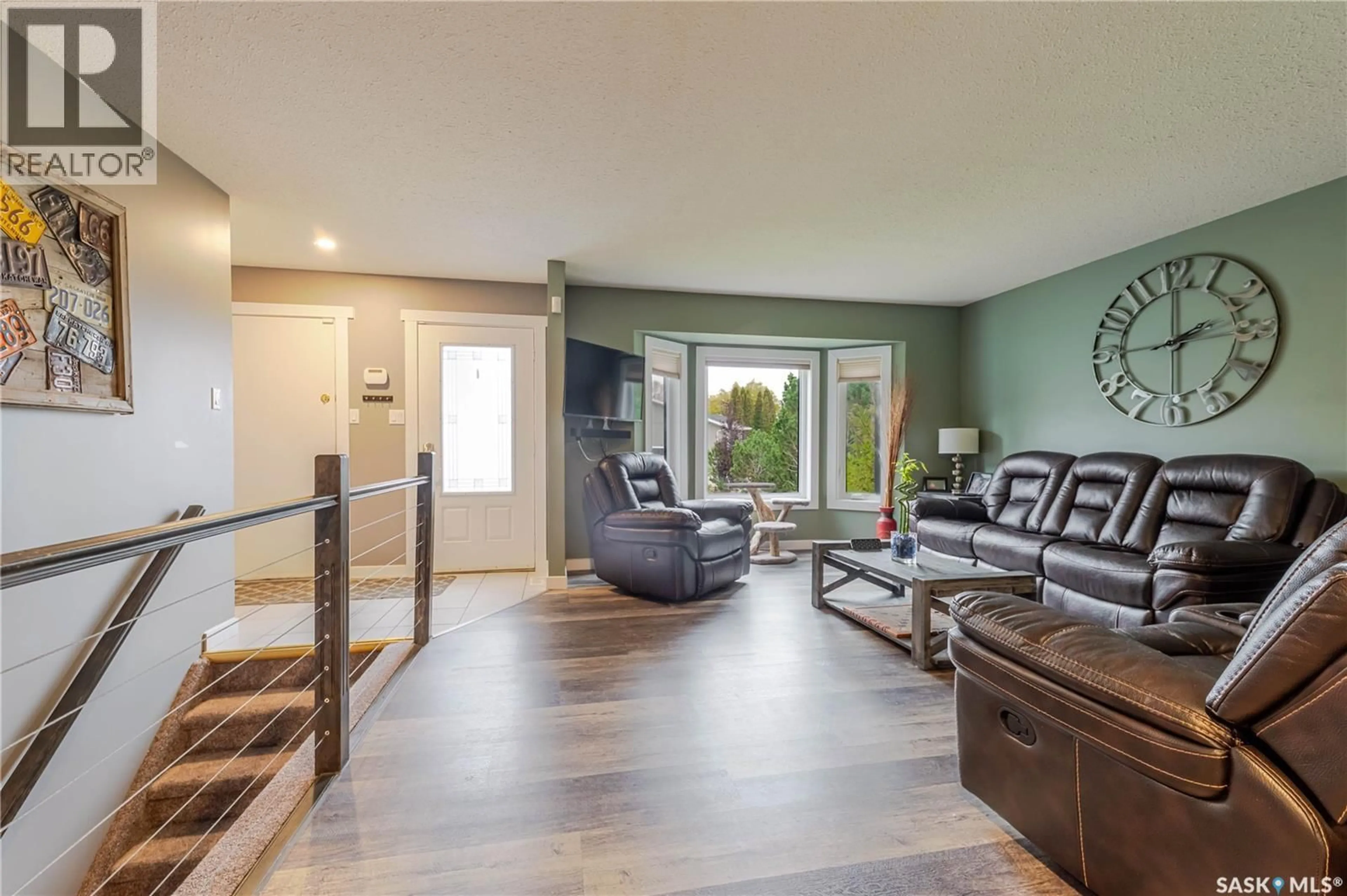 Living room with furniture, wood/laminate floor for 41 TAYLOR CRESCENT, Moose Jaw Saskatchewan S6J1J6
