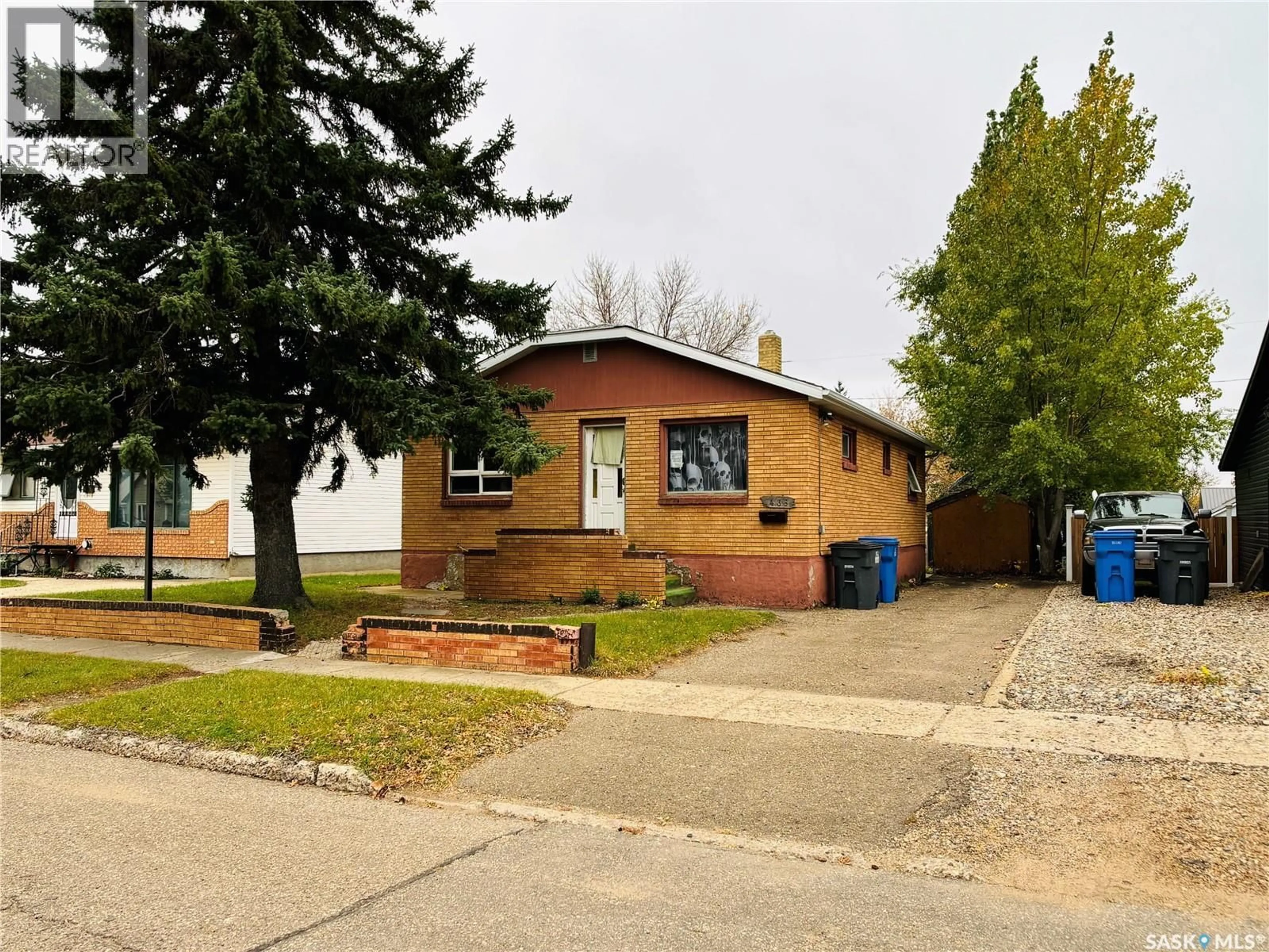 Home with brick exterior material, street for 438 3RD STREET, Estevan Saskatchewan S4A0P2