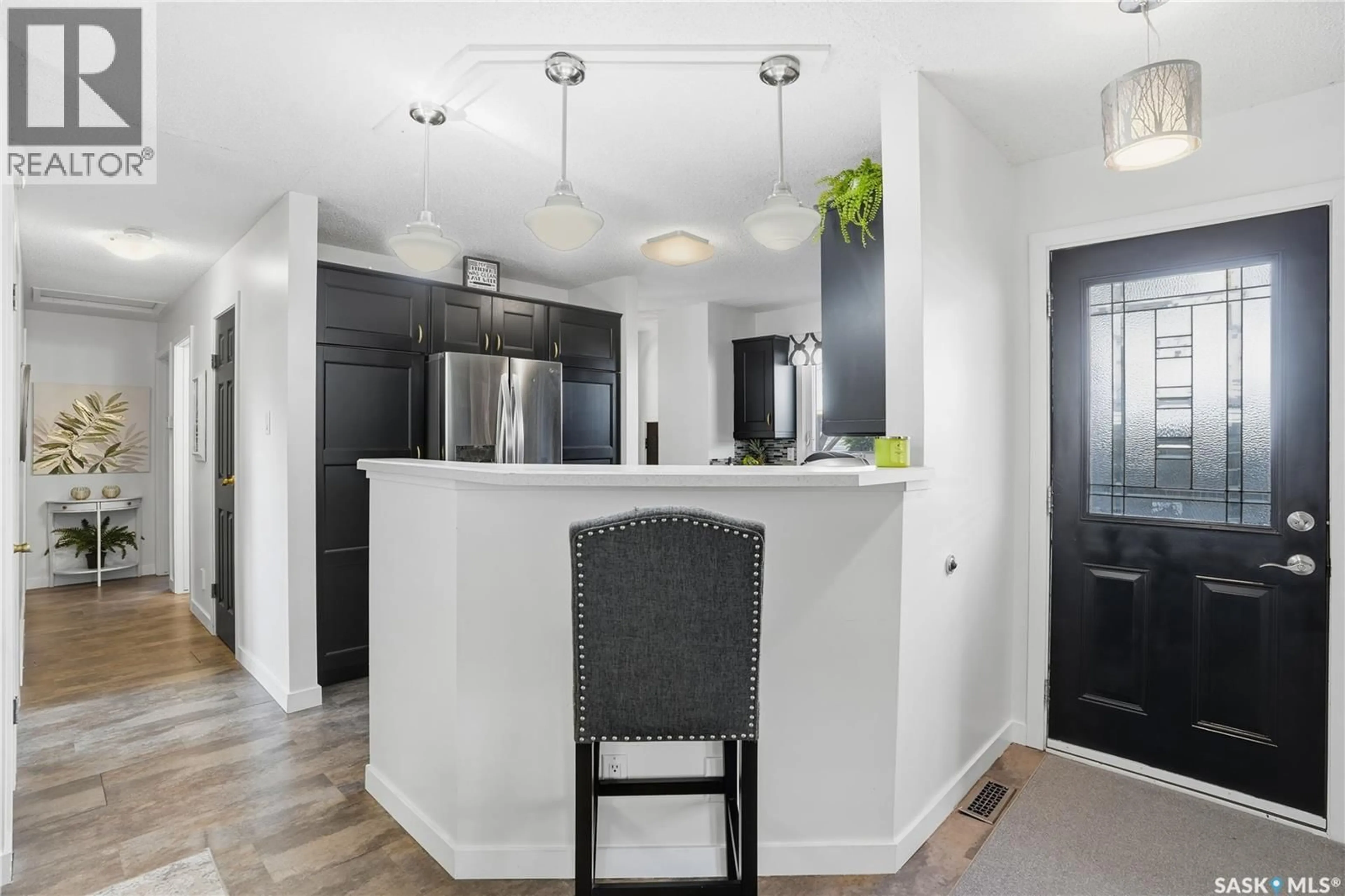 Open concept kitchen, ceramic/tile floor for 56 JACKSON BAY, Regina Saskatchewan S4R6T8