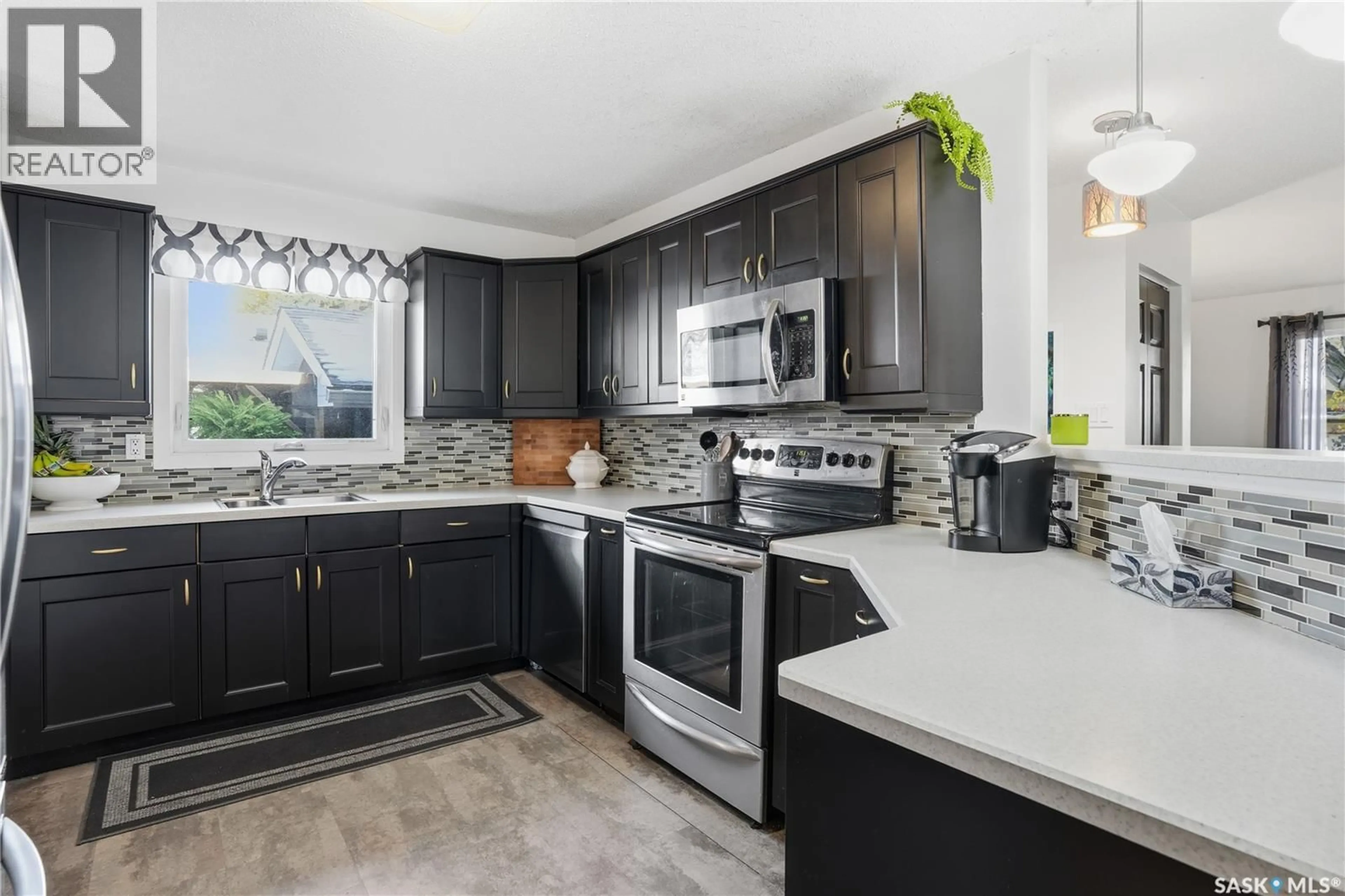 Open concept kitchen, ceramic/tile floor for 56 JACKSON BAY, Regina Saskatchewan S4R6T8