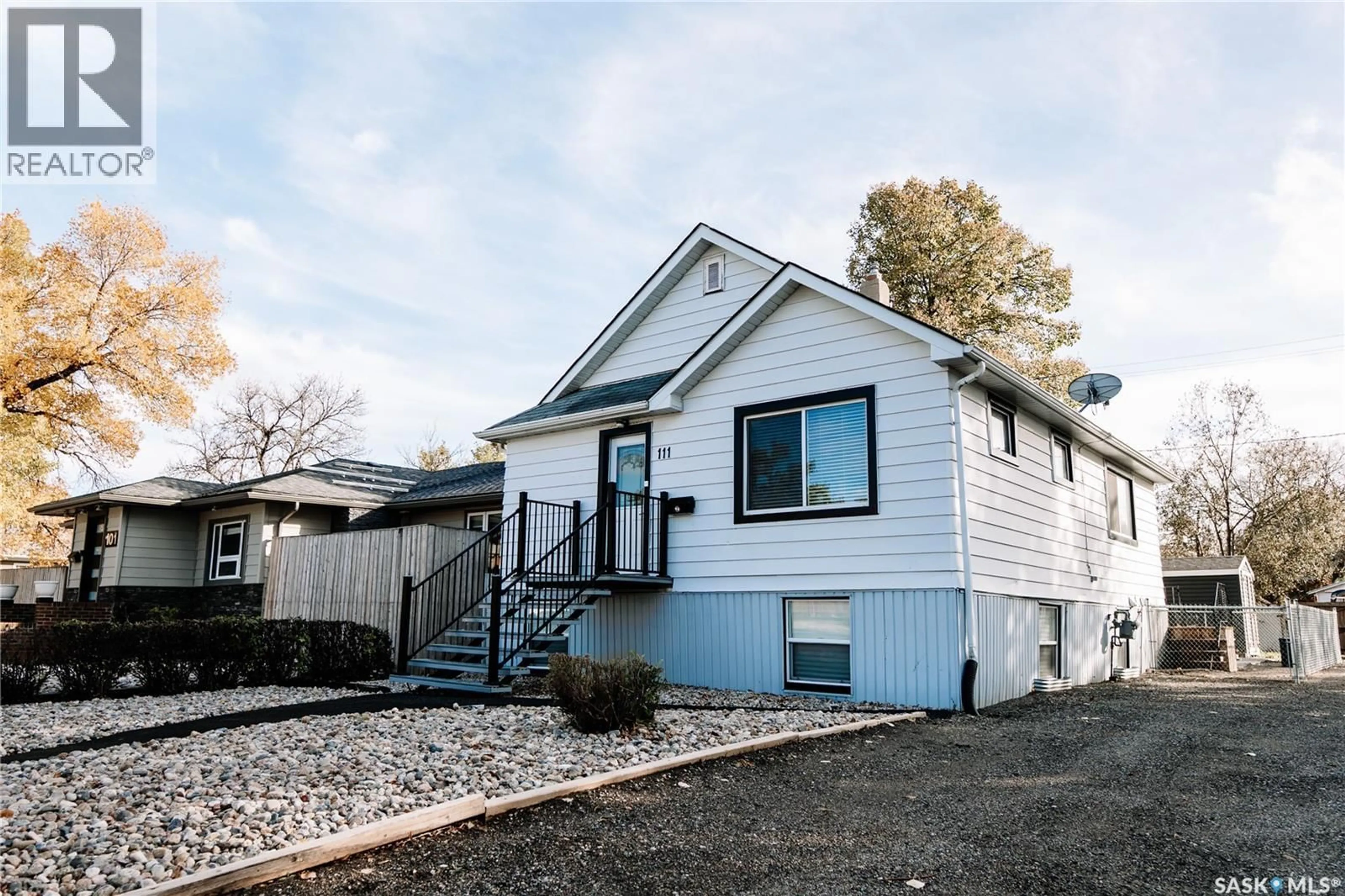 Home with vinyl exterior material, street for 111 COLLEGE AVENUE, Regina Saskatchewan S4N0W4